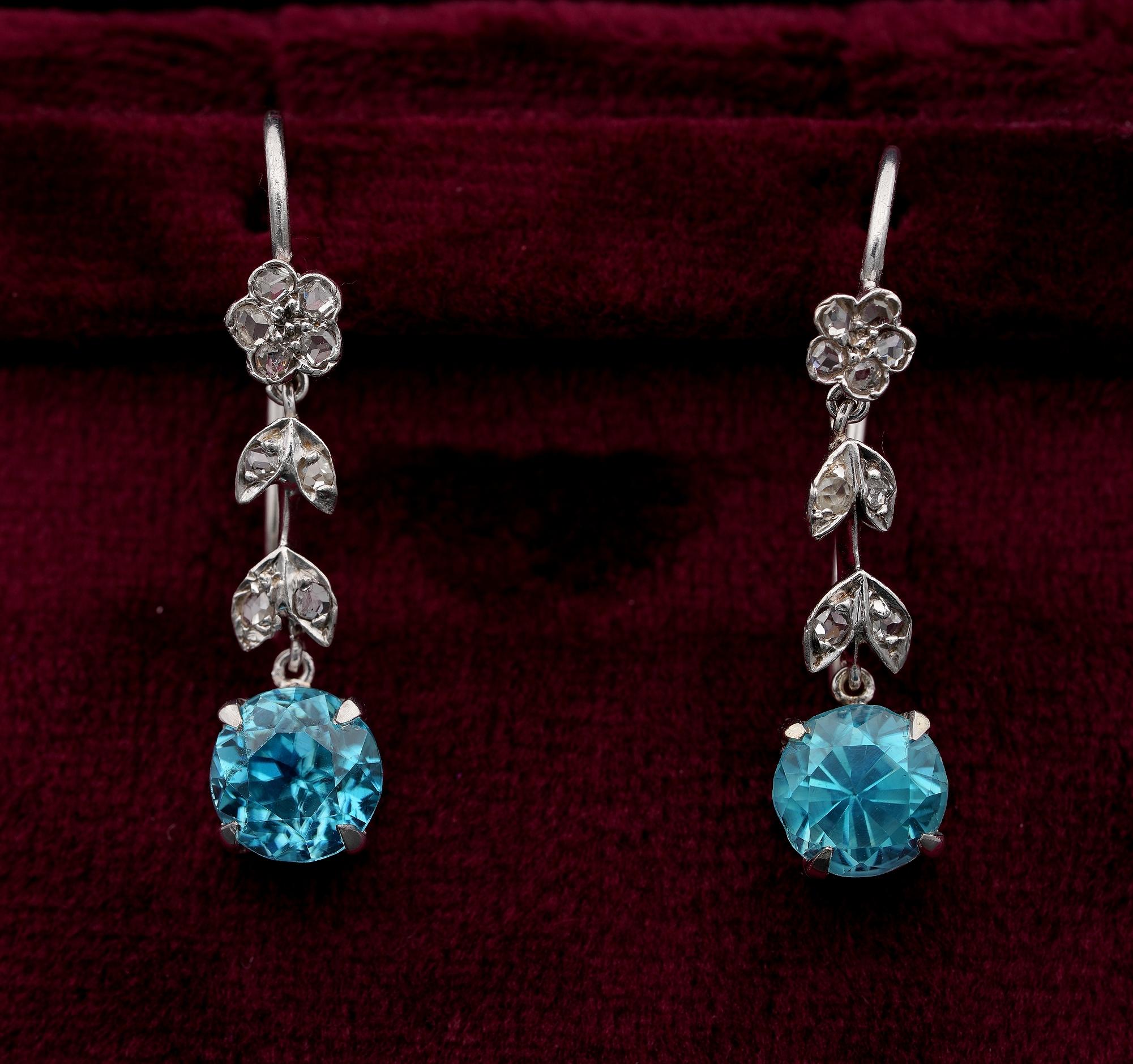Pretty Blue
The prettiest Art Deco Blue Zircon drop earrings finely hand crafted of Platinum
Top tiny flower in a line of sweet leaf work leads to the main drop
Set with Rose Cut Diamonds approx .36 Ct, bright white and sparkly
Wonderful Natural