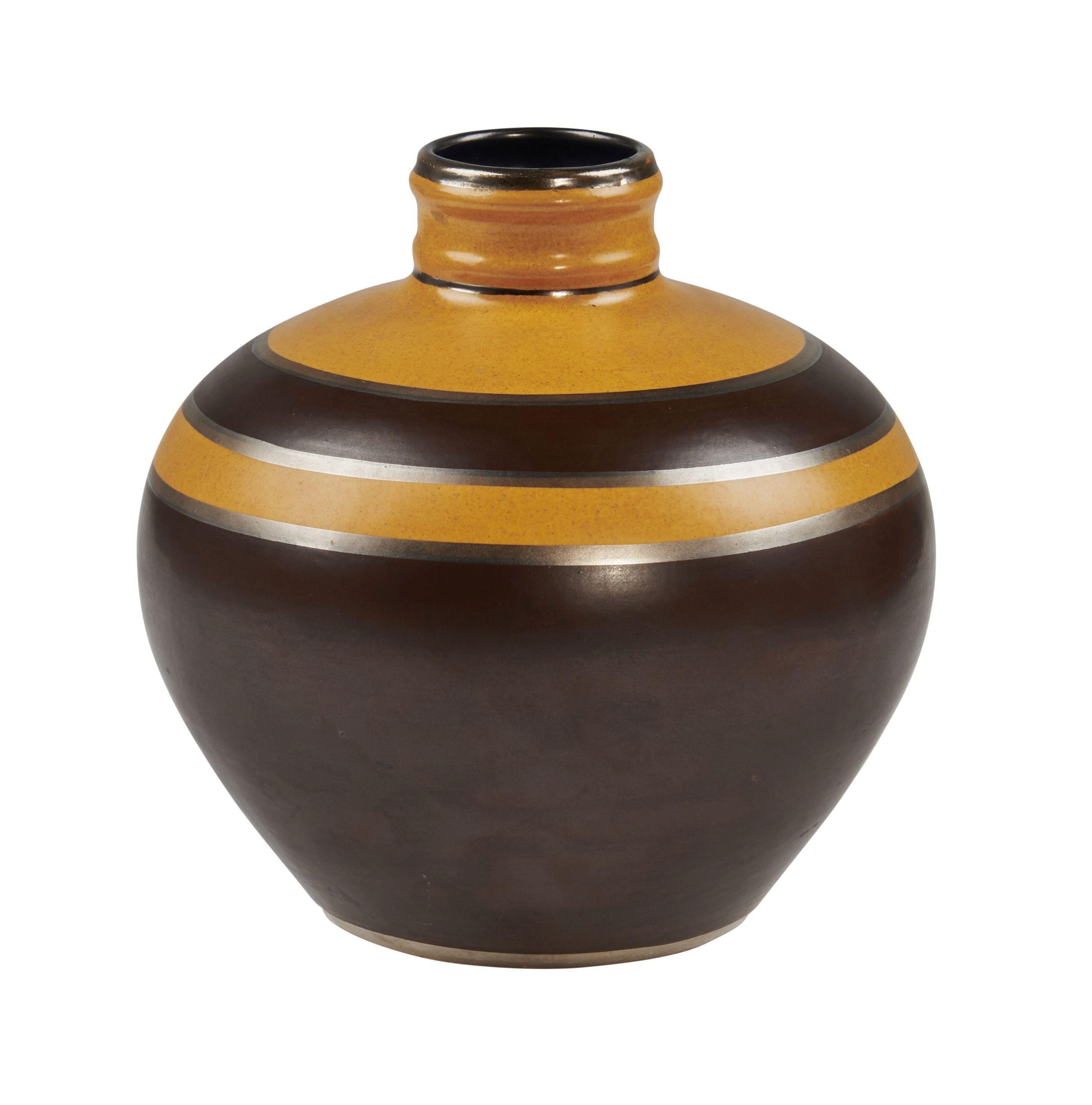 Boch Freres Keramis, Belgium. Rare Art Deco vase in glazed ceramics. Brown and orange glaze 1930s. Fine polychrome glazed earthenware in imitation of brassware
Stamped and numbered
Model number: D1818 -446
Featured in catalog raisonné #756