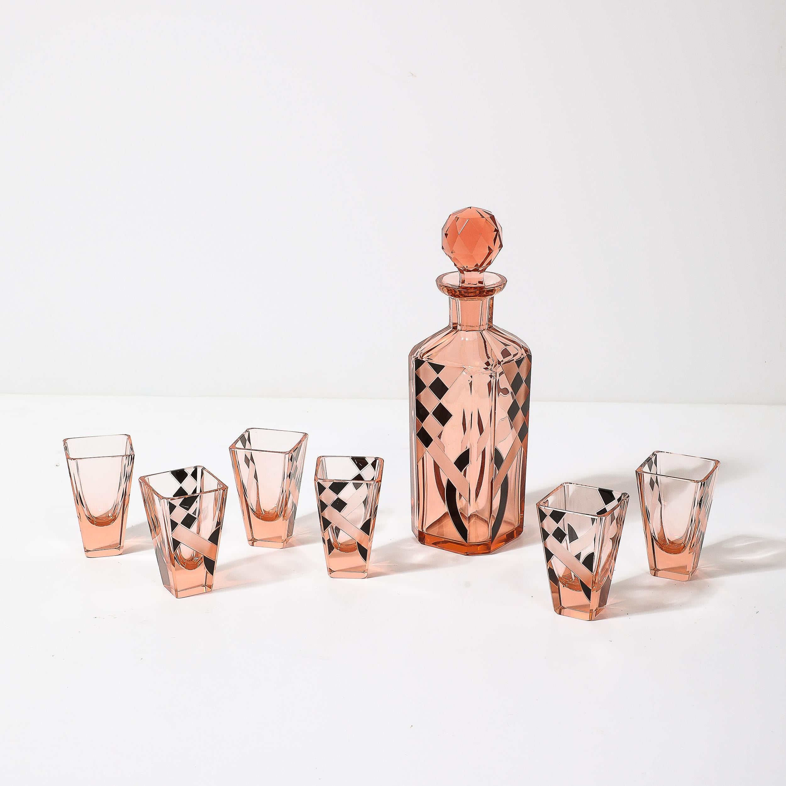 This sleek and brilliantly designed Art Deco Bohemia Cubist Decanter Set in Smoked Rose W/Diamond Patterning in Black and Frosted Glass originates from Czechoslovakia, Circa 1930. Features a classic decanter form with lovely checkered patterning in