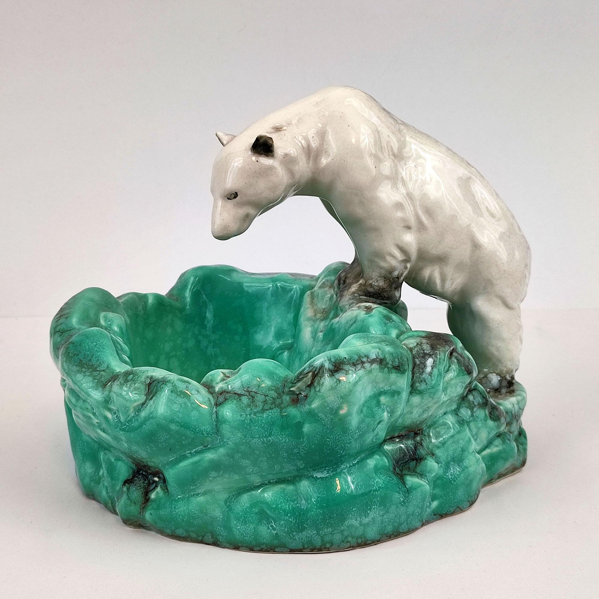 Art Deco Bohemian Ditmar Urbach Pottery Polar Bear bowl Videpoche.
A Czechoslovakian 1930s pottery polar bear at ice pool figure / bowl / videpoche / ashtray, by Ditmar Urbach. Makers mark under the bottom. In good original condition, minor signs of