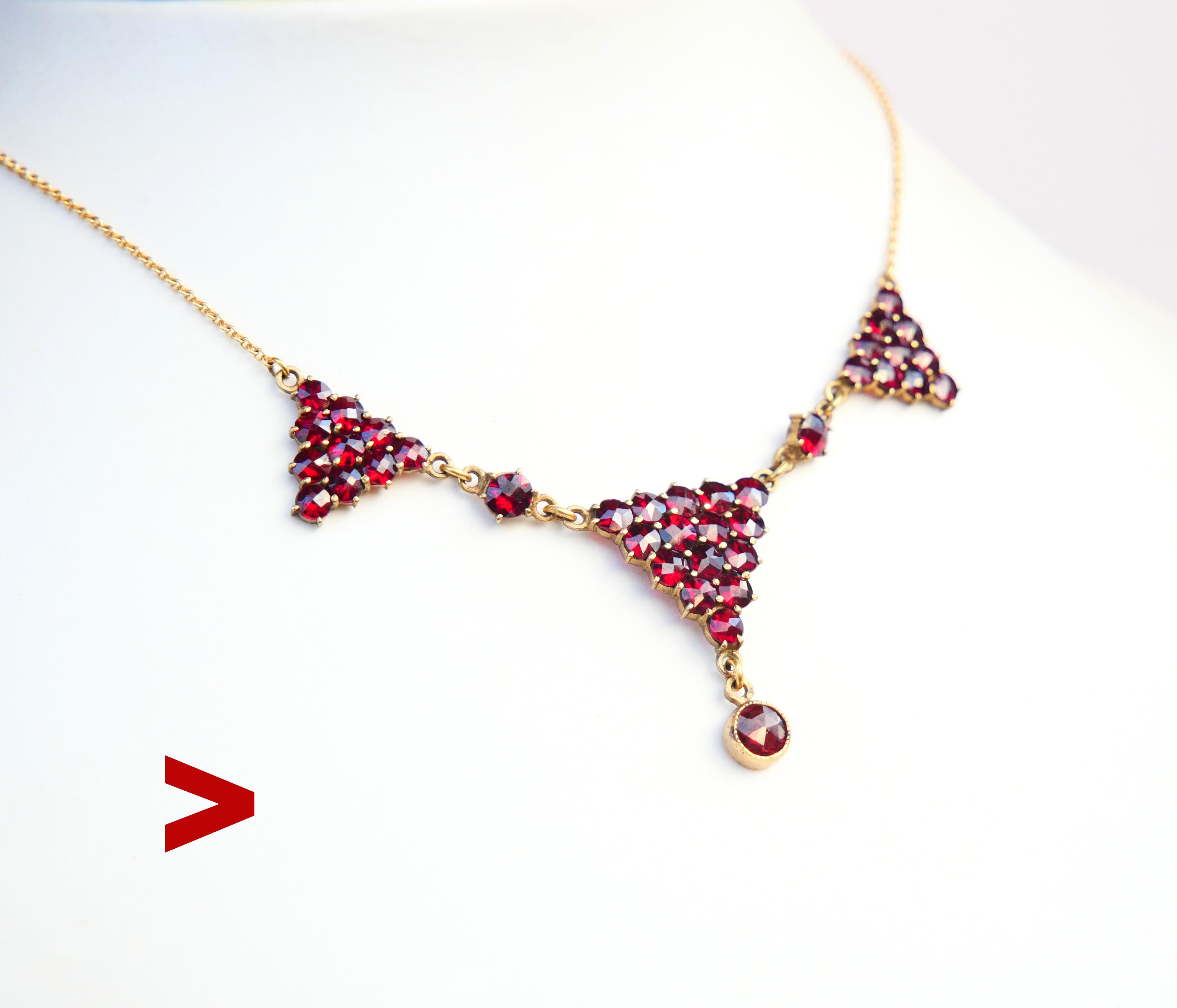 Art Deco period ca. 1930s Bohemian Garnet Necklace featuring clusters in Gilt Silver and chain in solid 18K Yellow Gold with C-lock.

No markings on the pendant. Chain hallmarked 18K.

I counted 37 rose-cut red Bohemian Garnet stones.

The length of