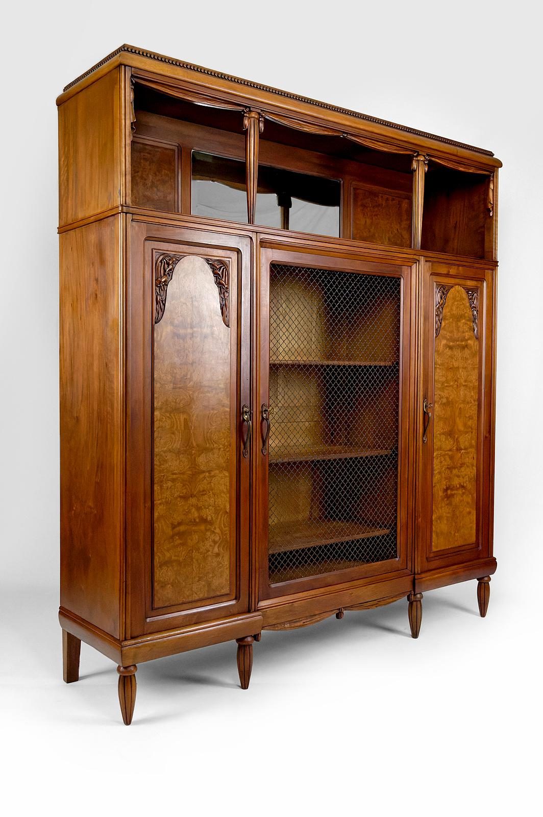 French Art Deco bookcase / cabinet / display case in carved walnut, France, circa 1925 For Sale