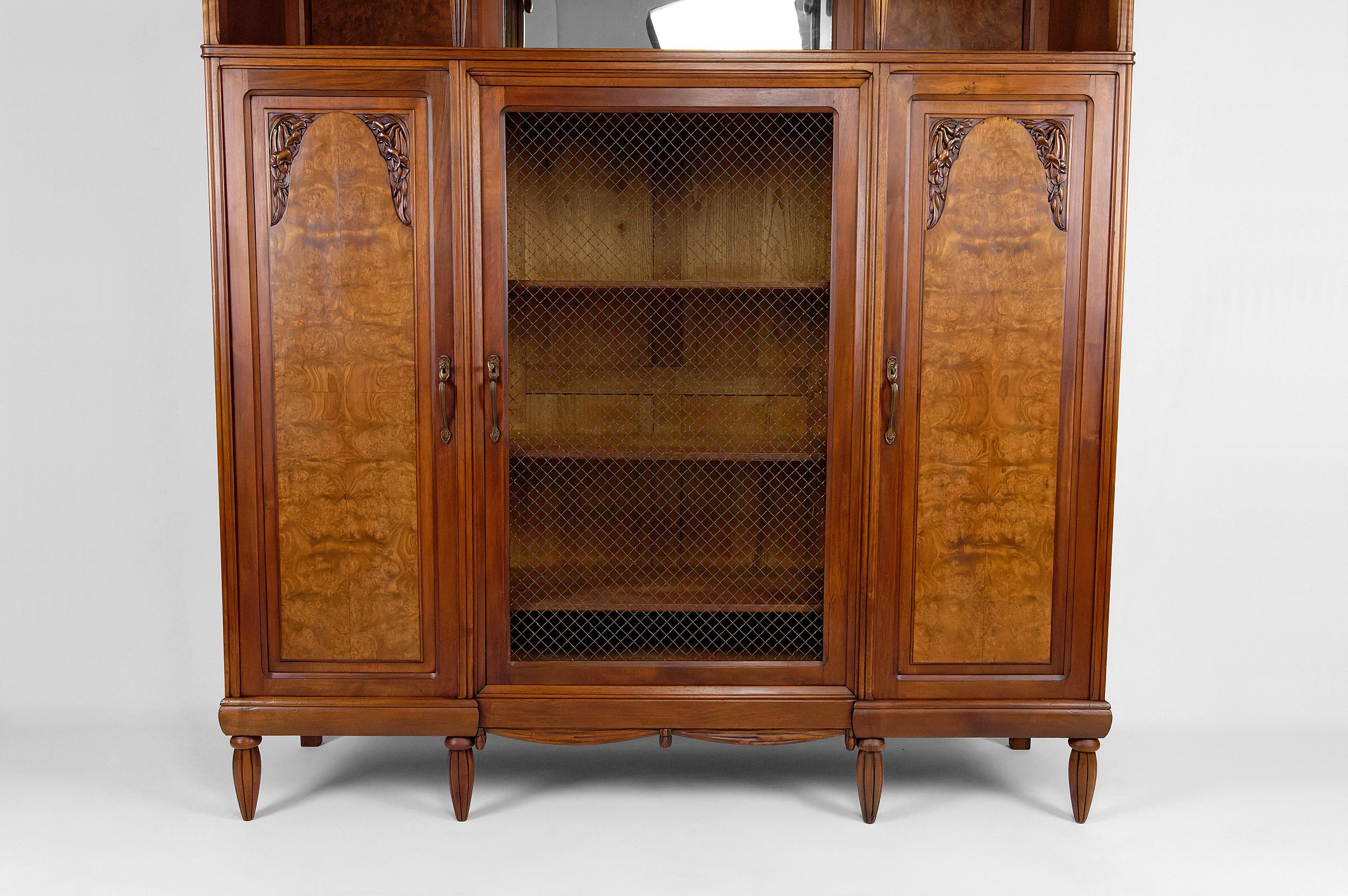 Early 20th Century Art Deco bookcase / cabinet / display case in carved walnut, France, circa 1925