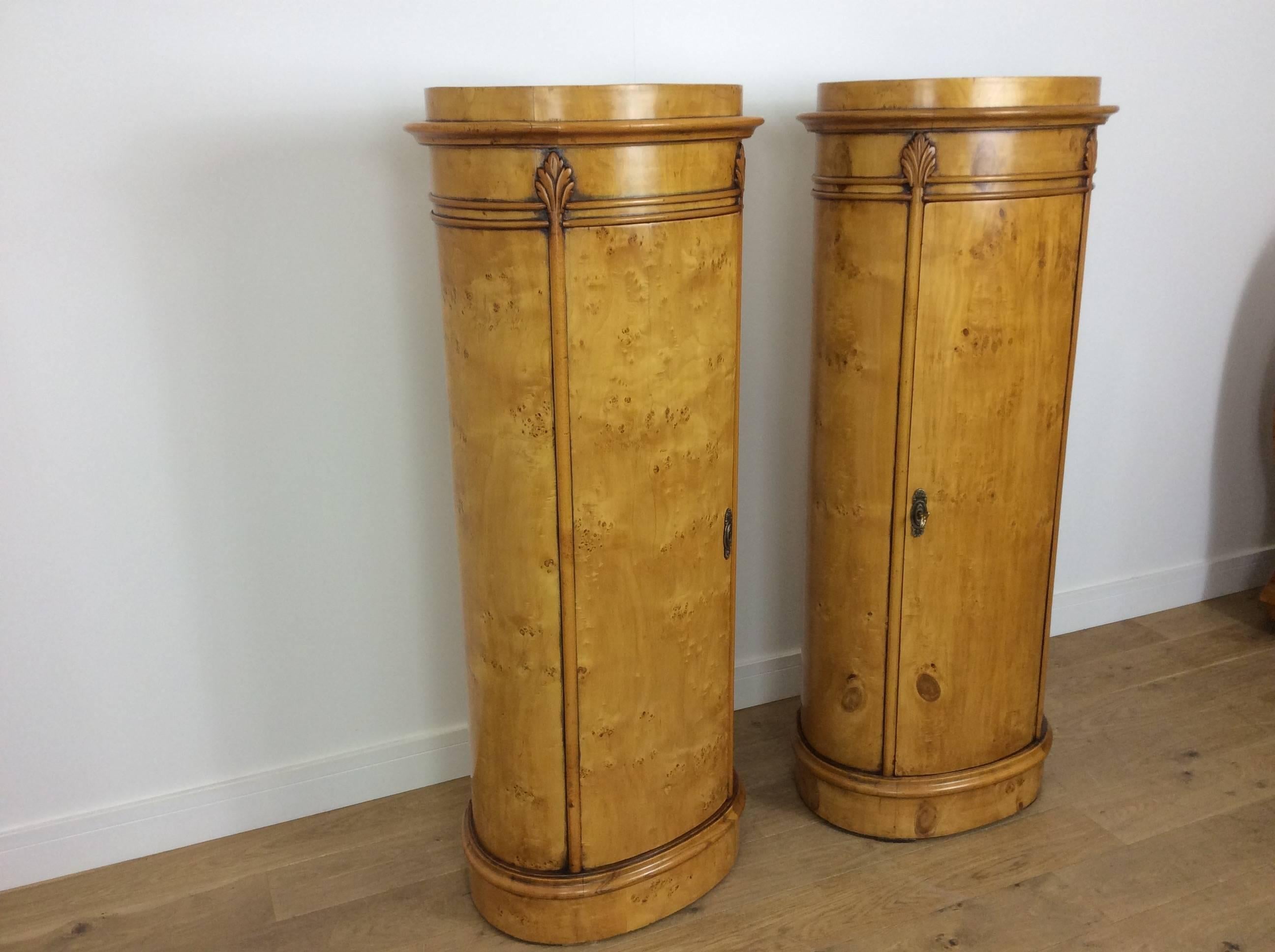 A pair of Art Deco pillars with cupboard storage, lockable
Measures: 147 cm H 64 cm W 40 cm D.
British, circa 1980.