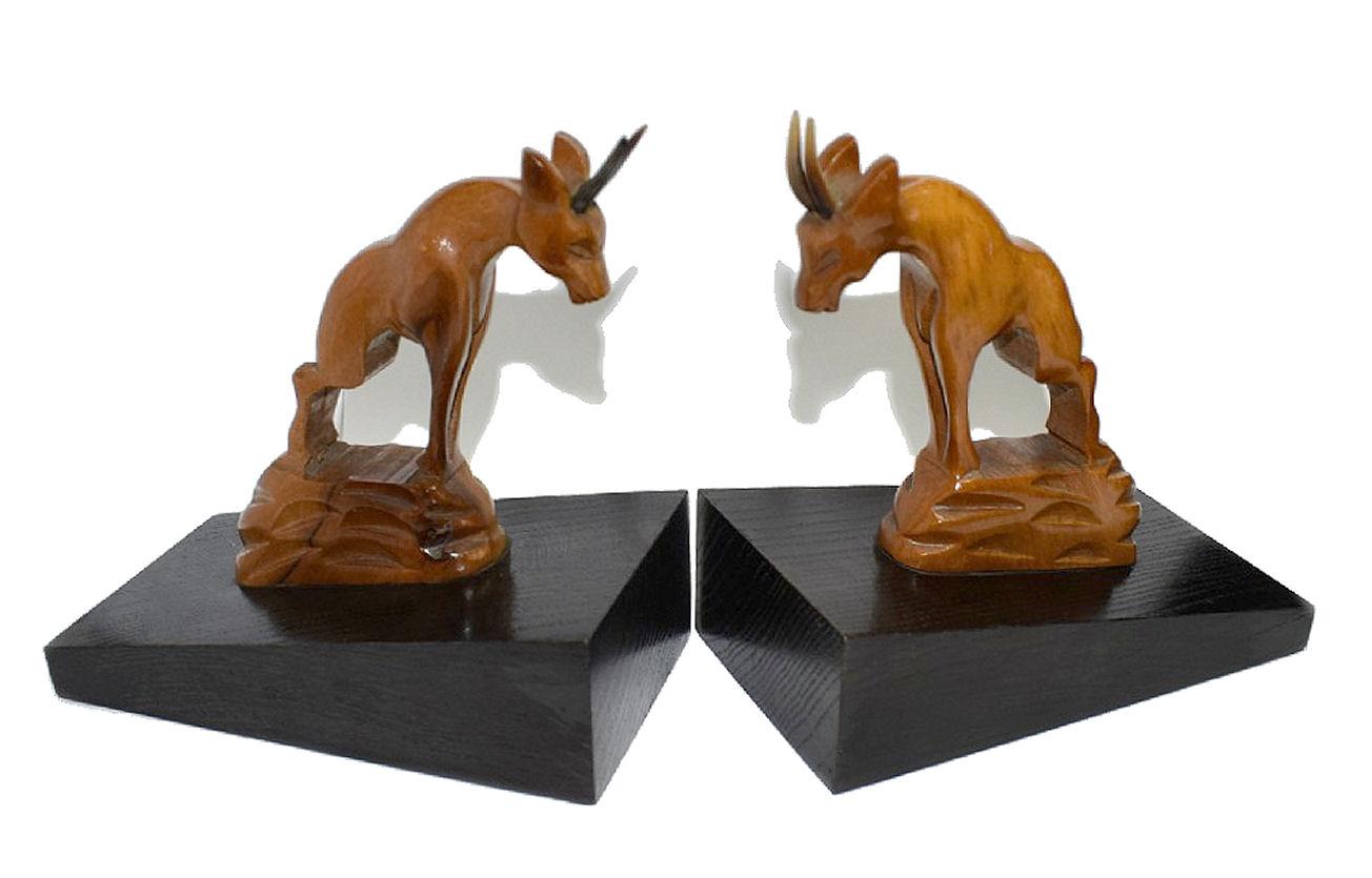For your consideration are these very stylish pair of Art Deco bookends depicting two Antelope climbing on a wall of black ebonised wood. Originating from France and dating to the 1930's these bookends are a nice size for modern day use. Condition