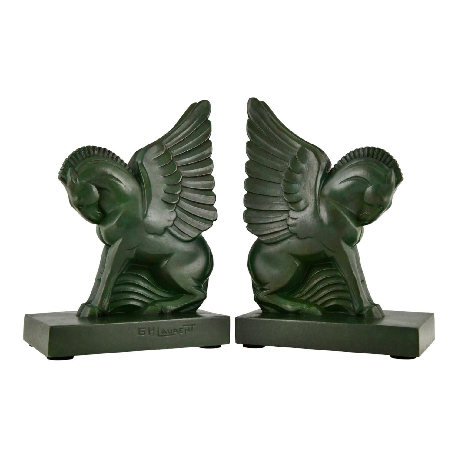 Discover these original Art Deco sculptures, a pair of exquisite Pegasus winged horse bookends by G.H. Laurent for Max Le Verrier (ca. 1930). Crafted in art metal with a green patina, these authentic 1930s French Art Deco bookends stand at 19 cm