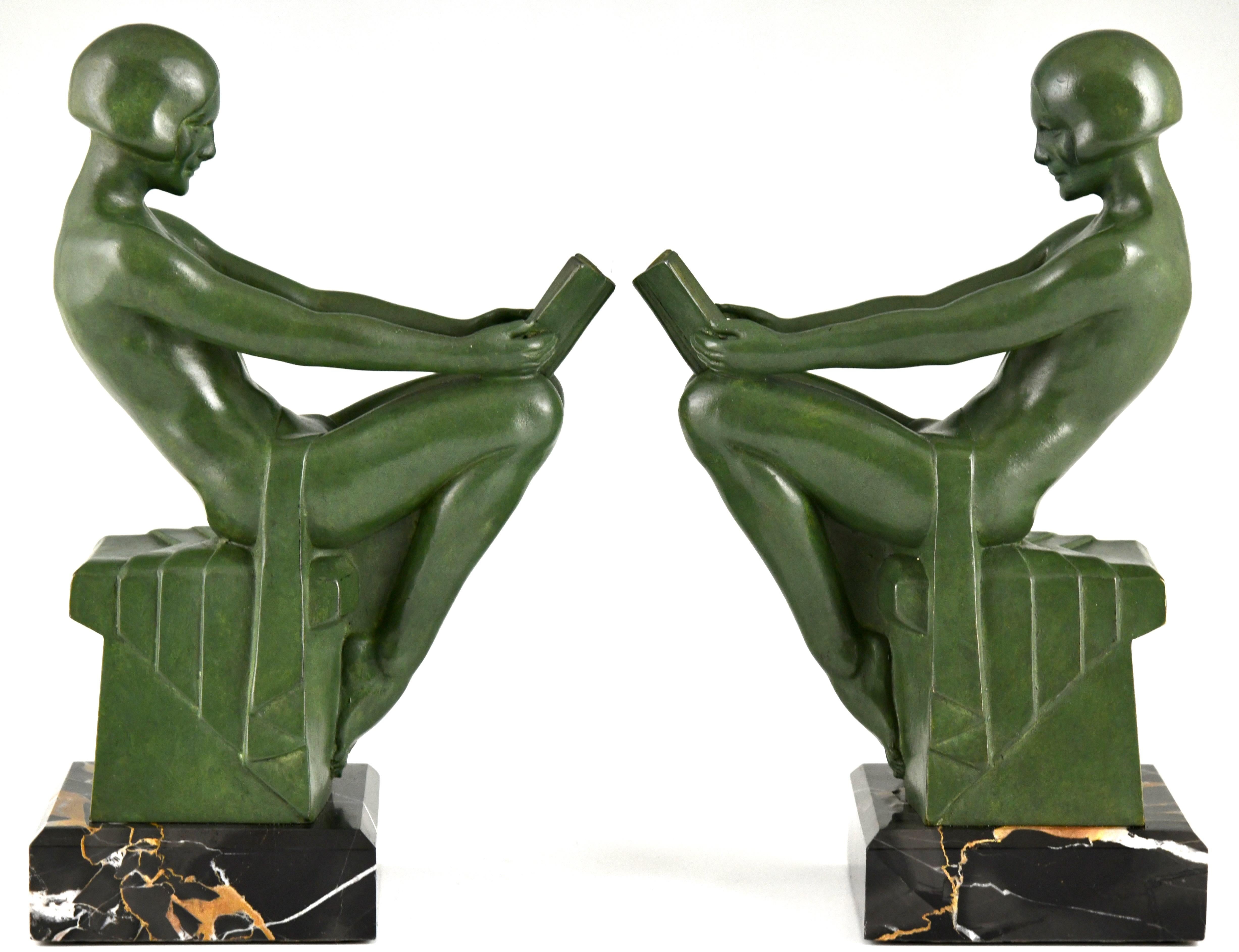 Patinated Art Deco bookends reading nudes Delassement by Max Le Verrier 1930
