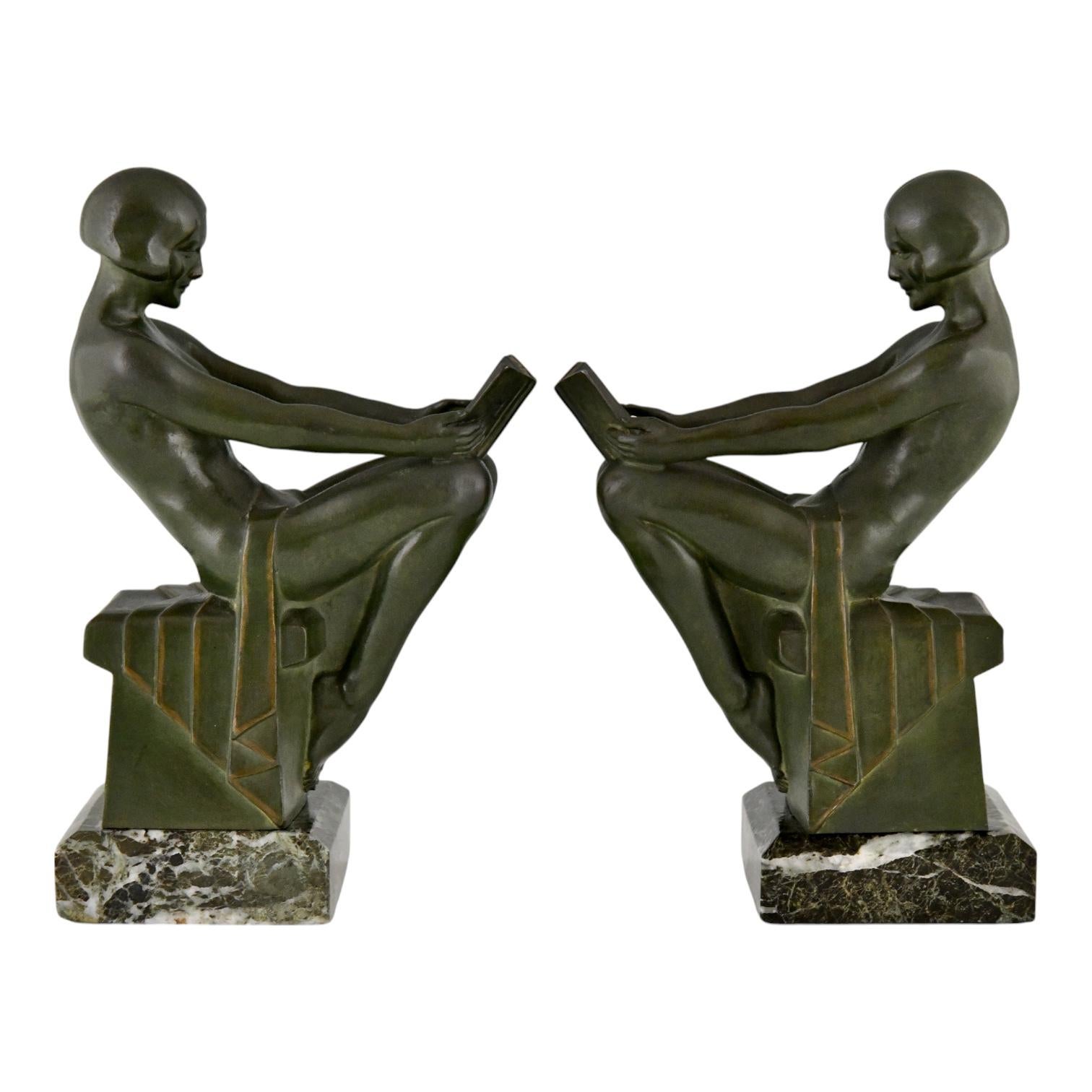 Patinated Art Deco bookends reading nudes Delassement by Max Le Verrier 1930