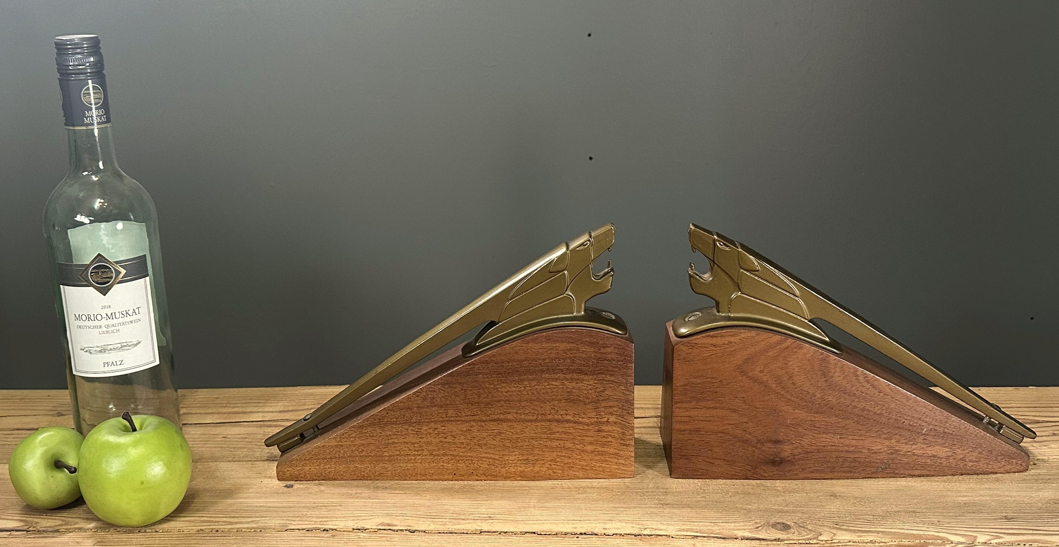 Art Deco Bookends, Scultures, France 1935

pair of hood ornaments from french peuget cars of the 1930s.
mounted on solid teak wood bases.