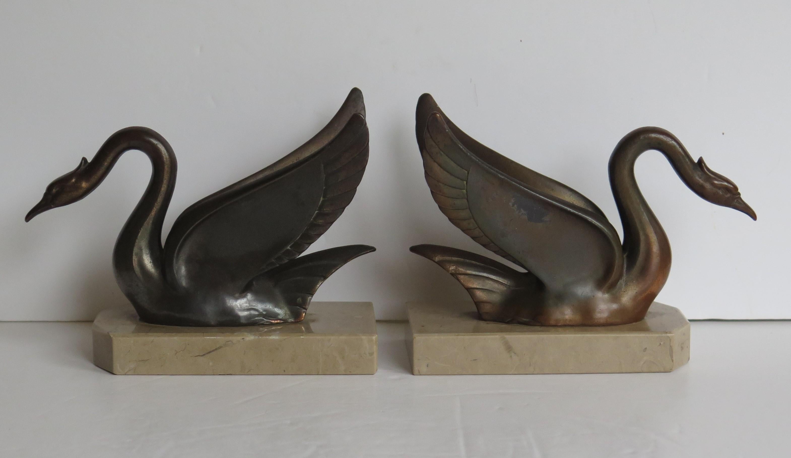 Cast Art Deco Bookends Swans Bronzed Metal on Beige Marble Bases, French, circa 1930 For Sale
