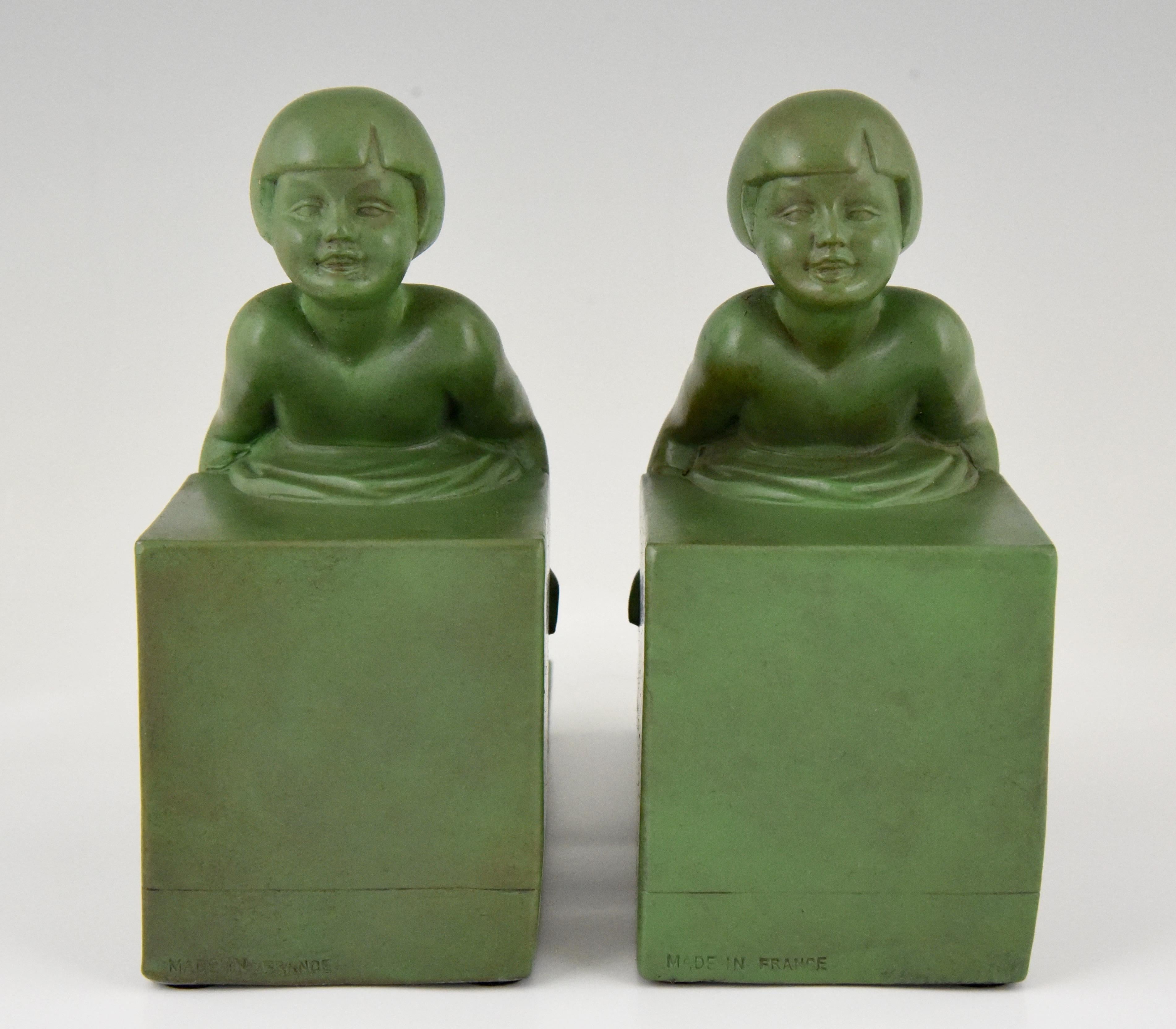 Patinated Art Deco Bookends with Children Signed Janle, France, 1930