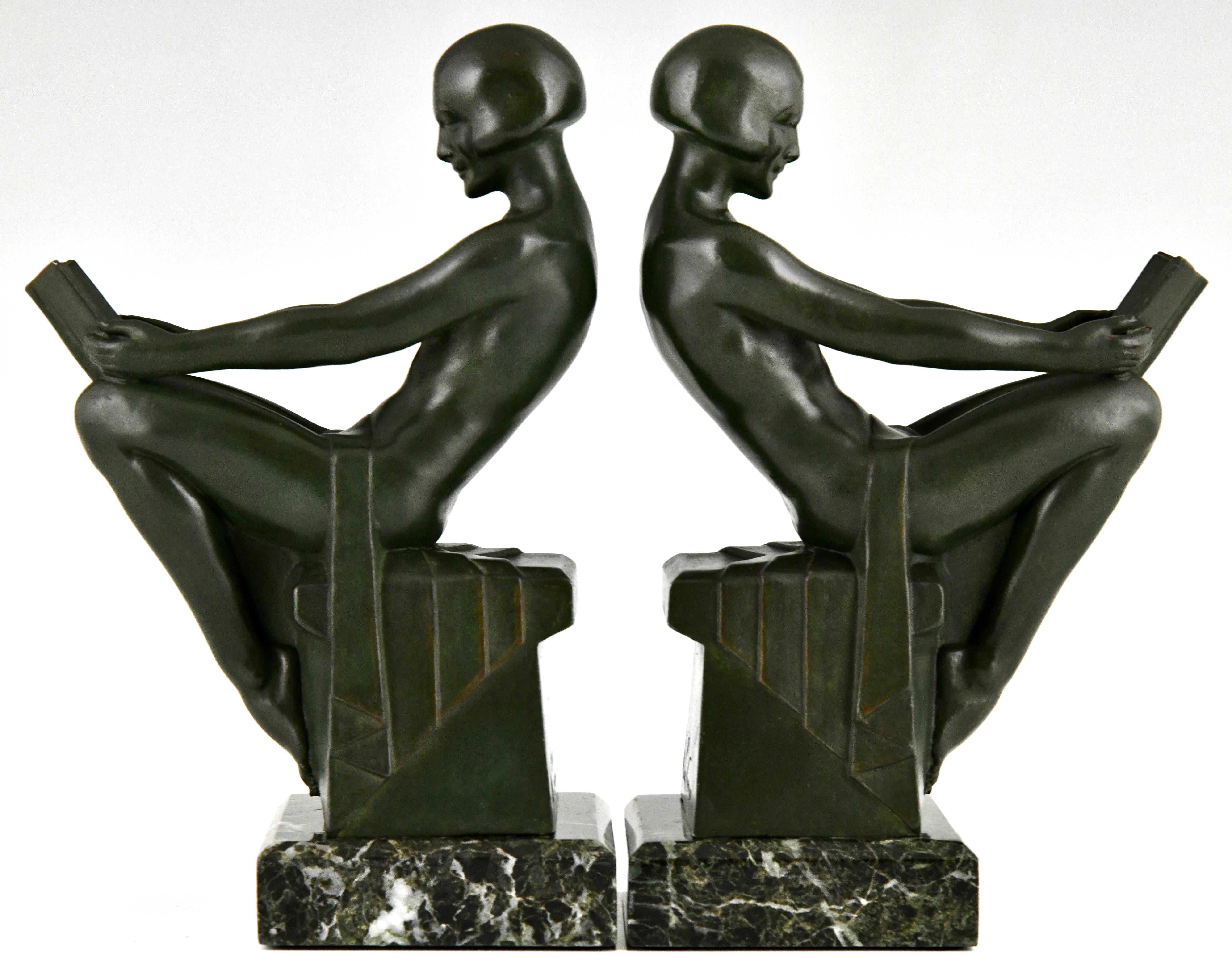 Art Deco bookends with reading nudes Delassement by Max Le Verrier.
Patinated Art Metal on green marble base.
Original Art Deco, France circa 1930.