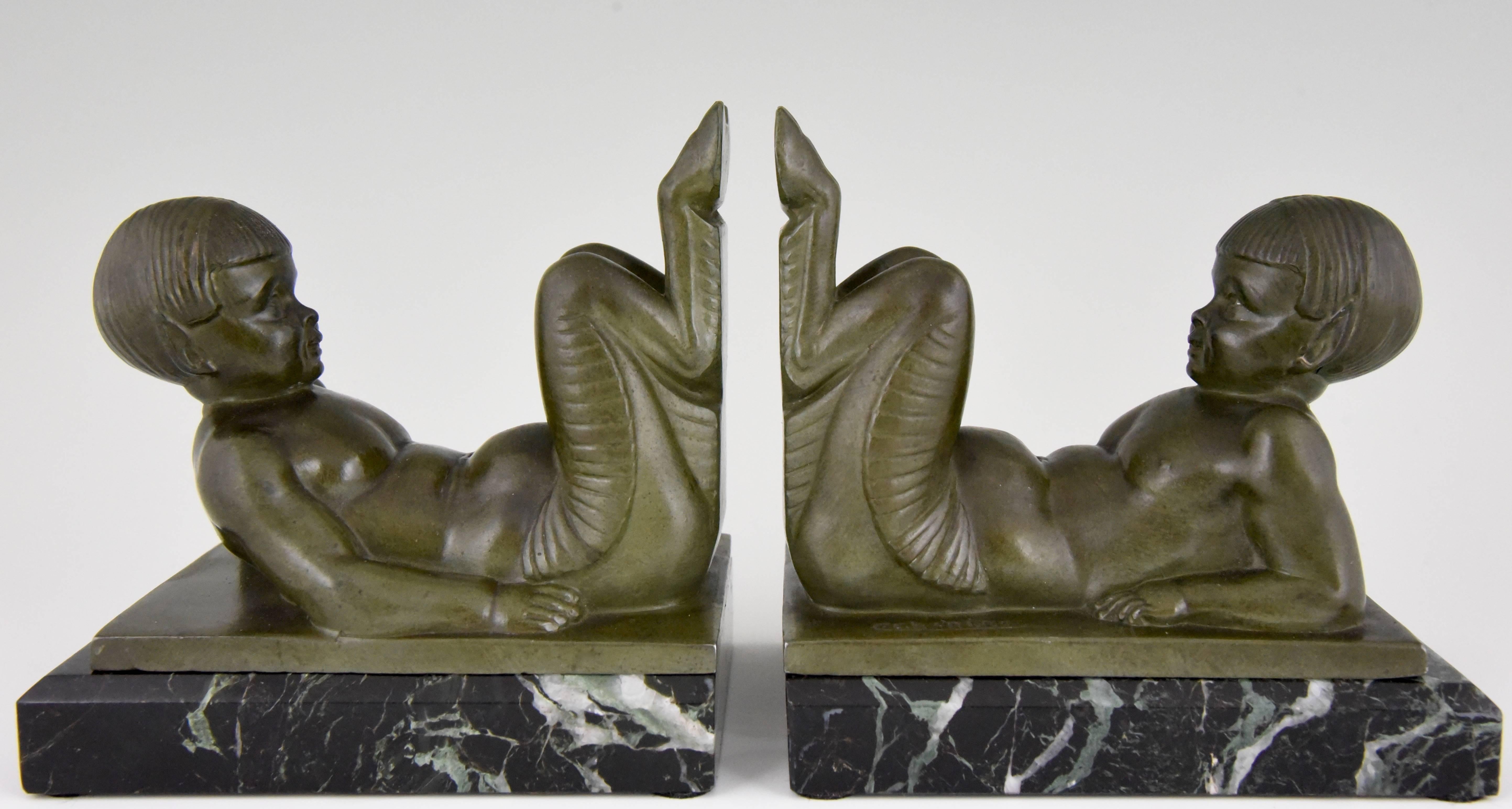 Description: Art Deco bookends with young satyrs. 
Artist / Maker: Charles Charles.
Signature / Marks: C. Charles.
Style: Art Deco. 
Date: circa 1930.
Material: Art metal with green patina on green marble base. 
Origin: France. 
Size of