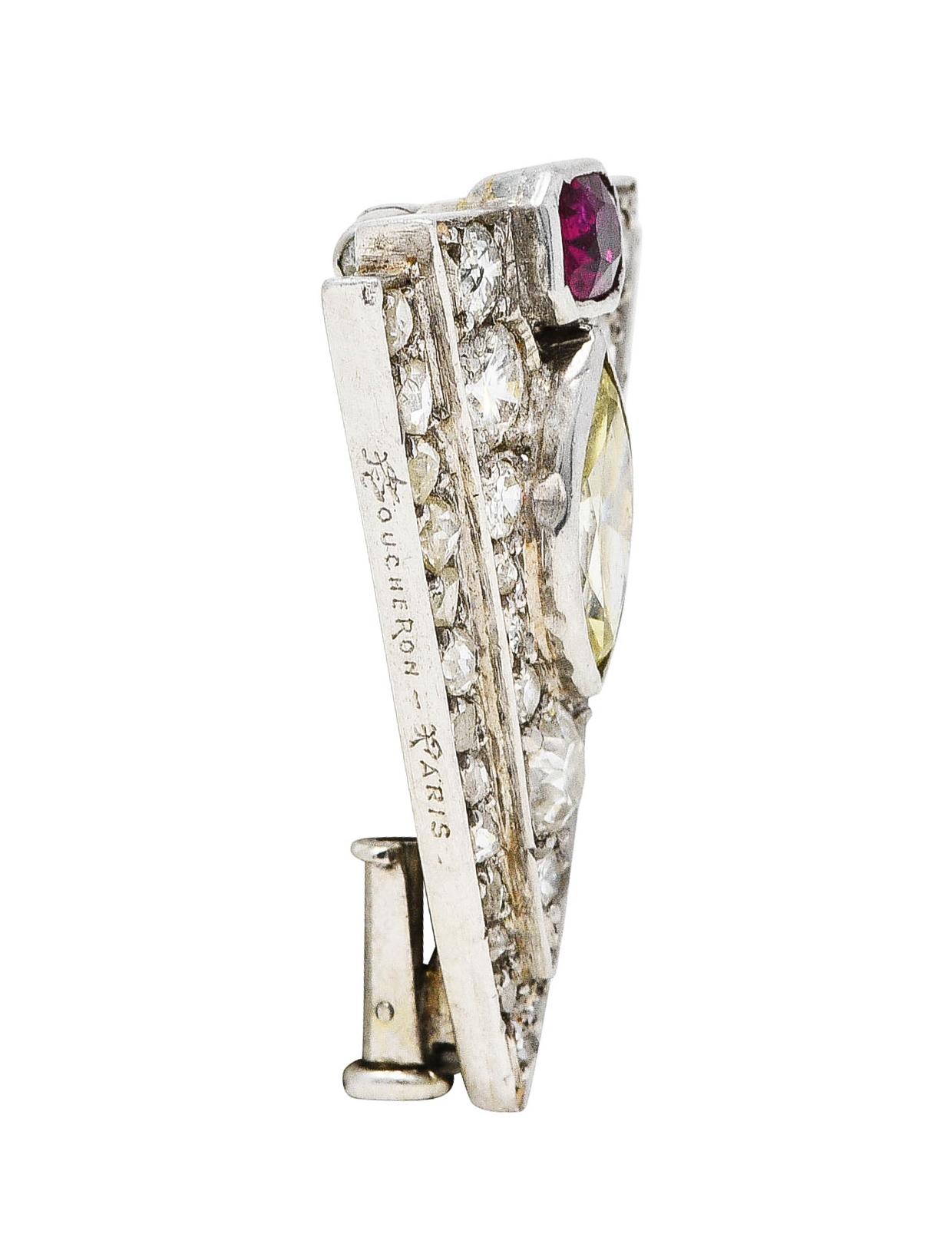 Brooch clip is triangular in form that centers a marquise cut diamond

Weighing approximately 0.40 carat - O/P+ in color with SI2 clarity

Topped by an emerald cut ruby weighing approximately 0.25 carat - slightly violetish and strongly