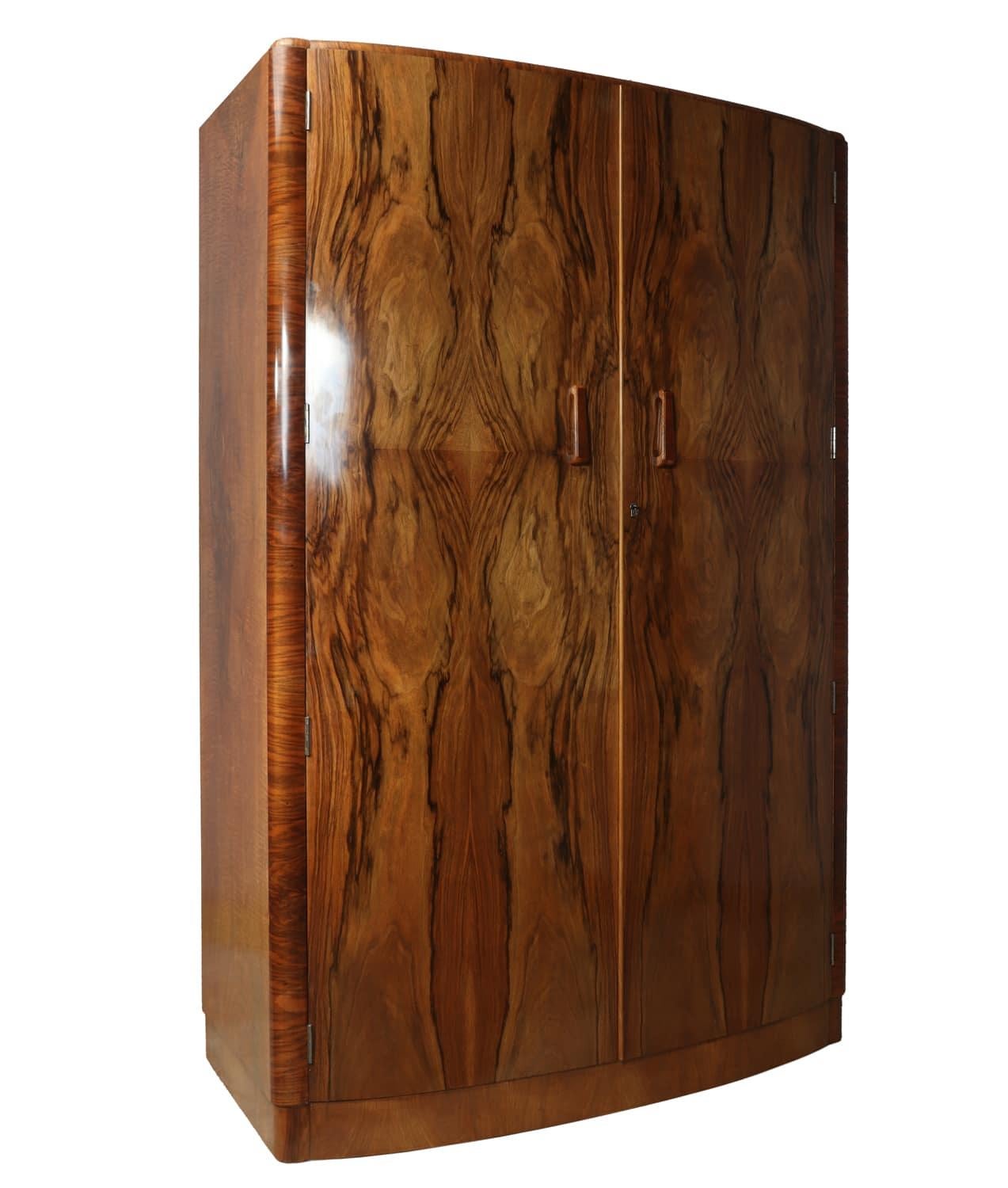 Art Deco bow fronted walnut two-door wardrobe
A Walnut Art Deco wardrobe in figured walnut with two hanging rails, the wardrobe has been professionally polished in excellent condition throughout

Age: 1930

Style: Art Deco

Material: