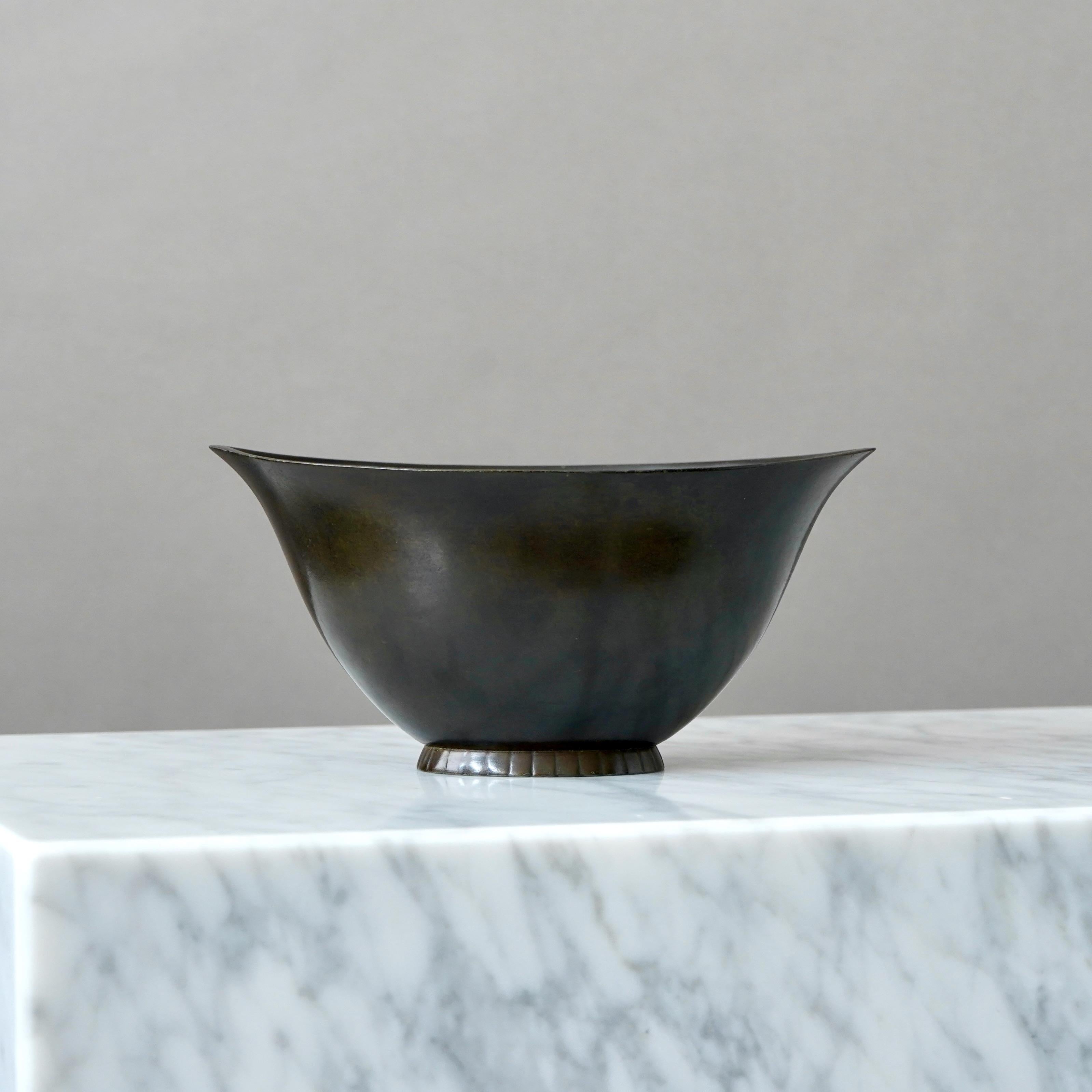 A beautiful art deco bowl designed by Just Andersen in 1920s and produced by his own company in Denmark. Made from Disko metal (an alloy of different metals invented by Just Andersen).

Great condition, only a few light scratches.
Stamped 'DENMARK',