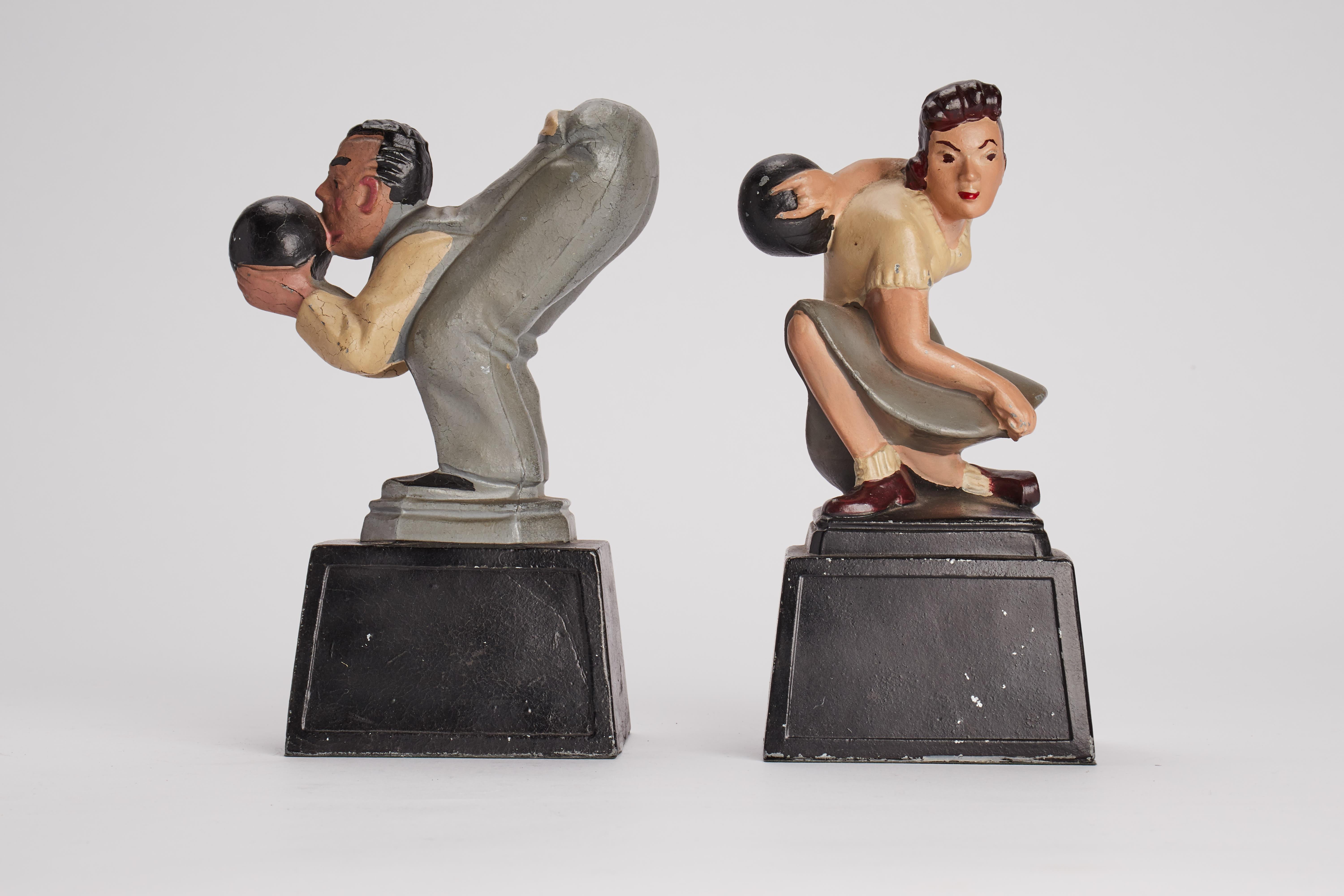 Unusual pair of American Art Deco’ bookends depicting a women and a man playing bowling. Painted white metal sculptures. USA circa 1930.