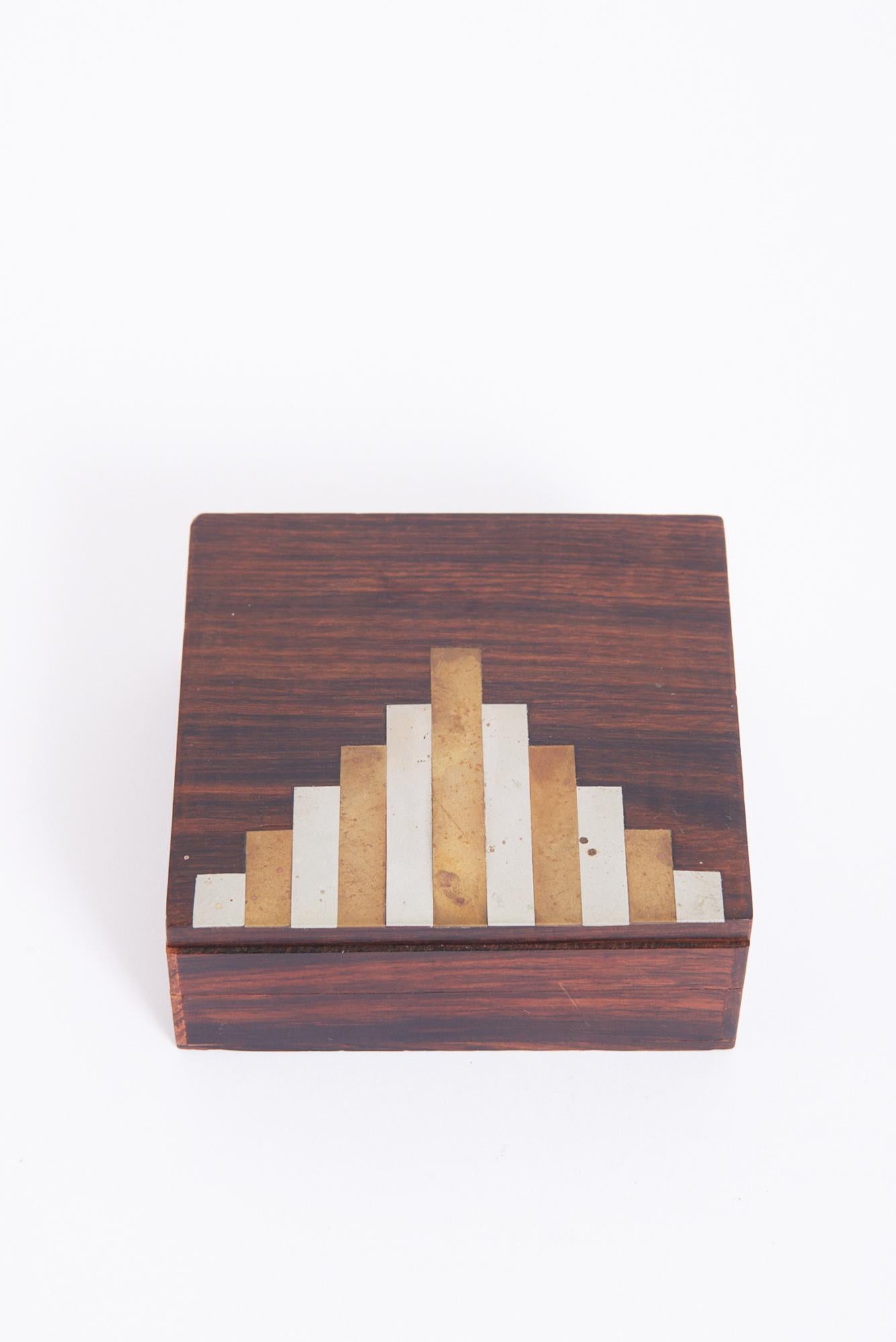 An Art Deco rosewood, brass and nickel box
France, Circa 1930

