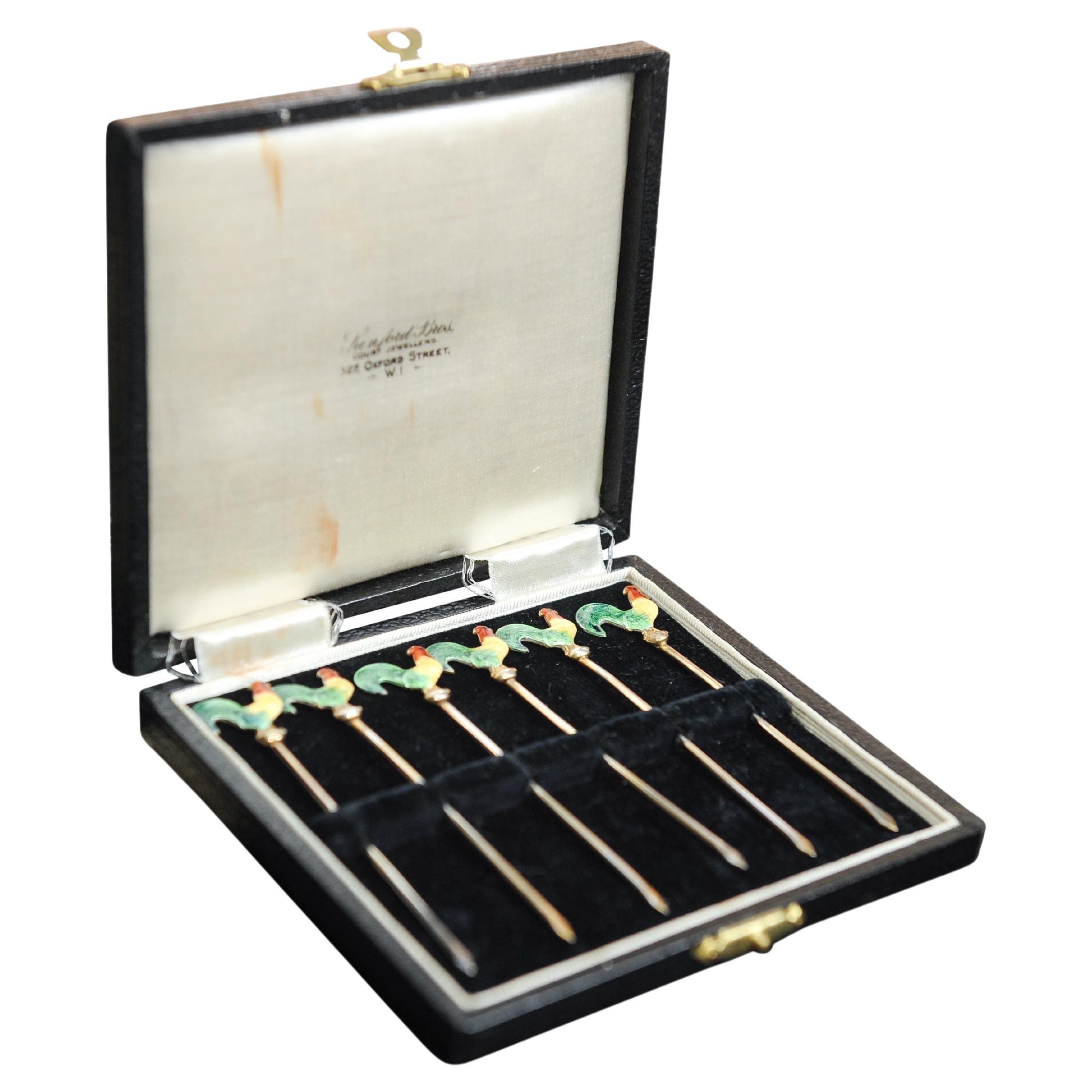 Art Deco Set of Six Sterling Silver, Gilt & Enamel Cocktail Picks Martini Sticks in The Form of Cockerels Exquisitely Boxed 

Out box is initialled A.E.P 

Stamped Sterling Silver on each cocktail pick
Court Jewellers of 327, Oxford Street, W1