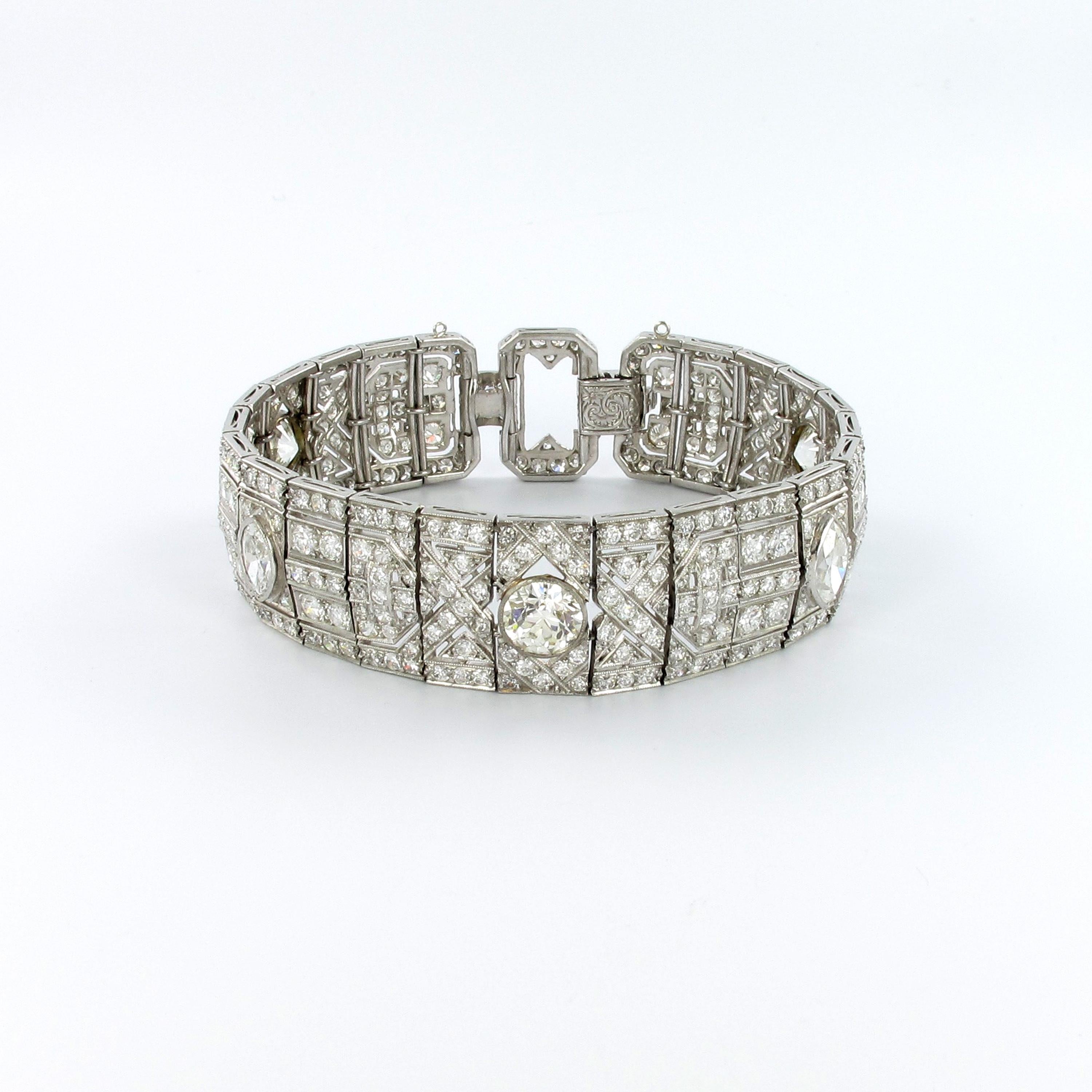 This bracelet is an Art Deco dream come true. Of geometric open work design, set with marquise and old European-cut diamonds. Millegrain-set with three old Euorpean-cut diamonds totalling 4.35 ct of I/J-vs quality and two marquise-cut diamonds