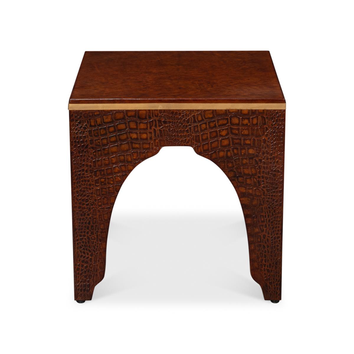 A testament to timeless elegance and luxury. Wrapped in sumptuous leather with a brown embossed croc finish, this brandy-hued stool exudes a refined charm that elevates any interior space.

Its sophisticated design, reflecting the grandeur of the