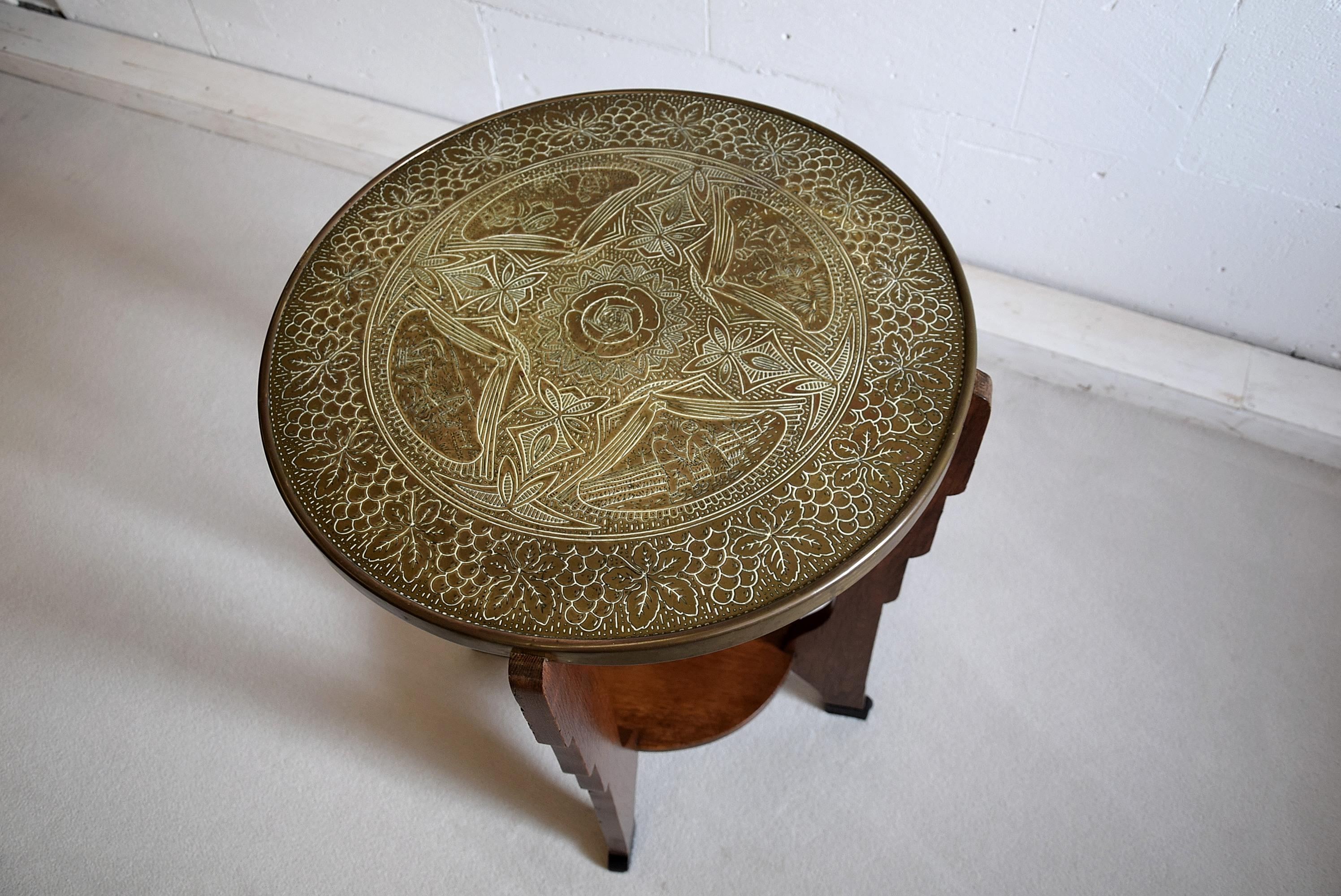 Brass and oak Amsterdam School Art Deco side table. Gorgeous and rare, made in the Netherlands in the 1920s .

This table will be shipped overseas in a custom made wooden crate. Cost of transport to the US crate included is Euro 450.