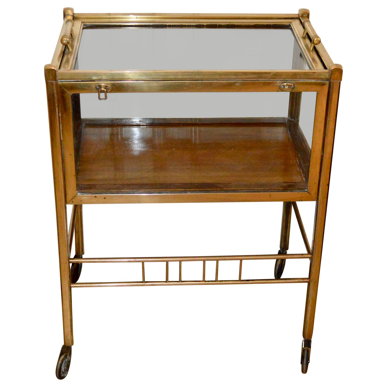 Art Deco brass and wood bar cart trolley by Ernst Rockhausen, Germany, 1920s.

   