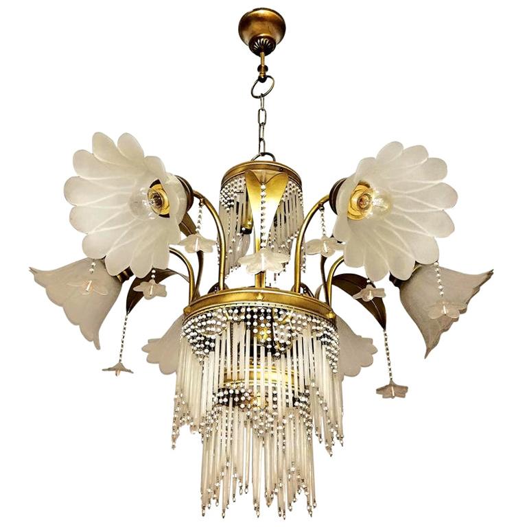 Antique large French Art Nouveau or Art Deco brass and beaded pale pink glass with frosted glass flower lamp shades, palm tree Hollywood Regency wedding cake nine-light bulbs chandelier
Measures:
Diameter 32 in/ 80 cm
Height 40 in (32 in and 8 in