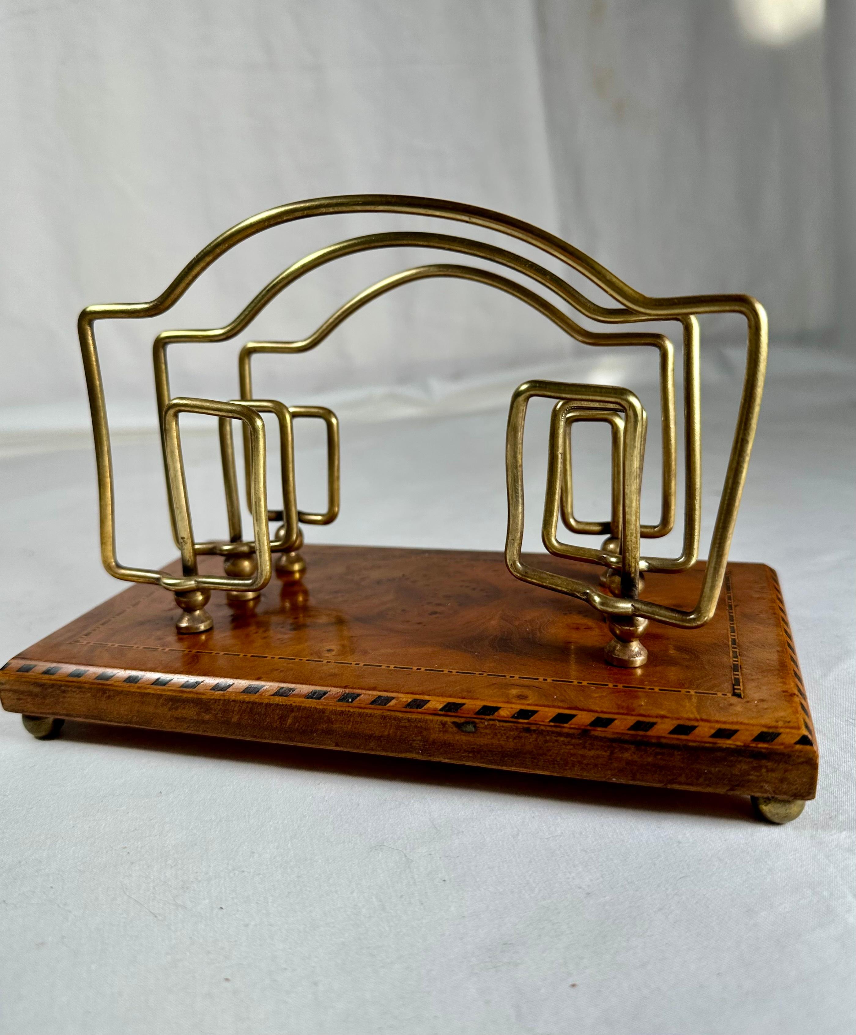 Art Deco French Brass Birdseye Maple Marquetry Desk Letter Holder.

Art Deco, circa 1950s wood inlaid desk letter holder in the style of Jean-Michel Frank; he was an inspired designer much associated with the Art Deco movement.  His modern,
