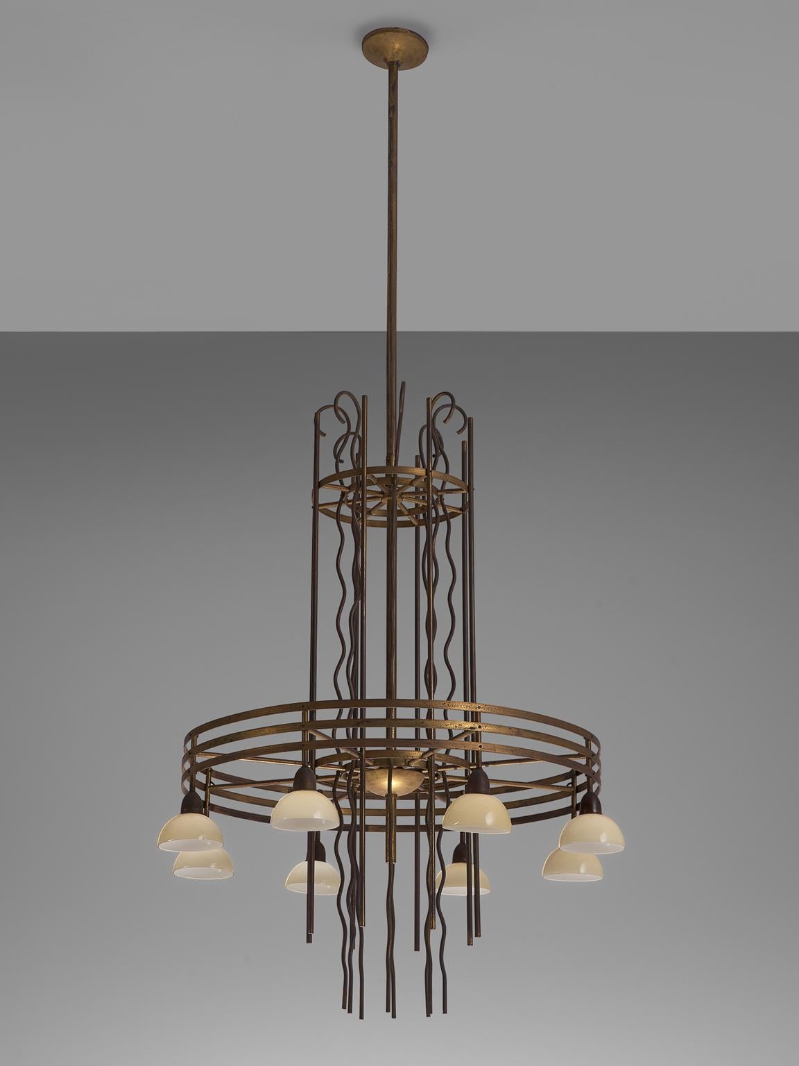 Art Deco chandelier, Sweden, 1930s.

Highly detailed brass chandelier from Sweden, made in the 1930s. This chandelier features two layers of multiple brass rings and organic shaped brass strings in between. The first layer contains one ring to