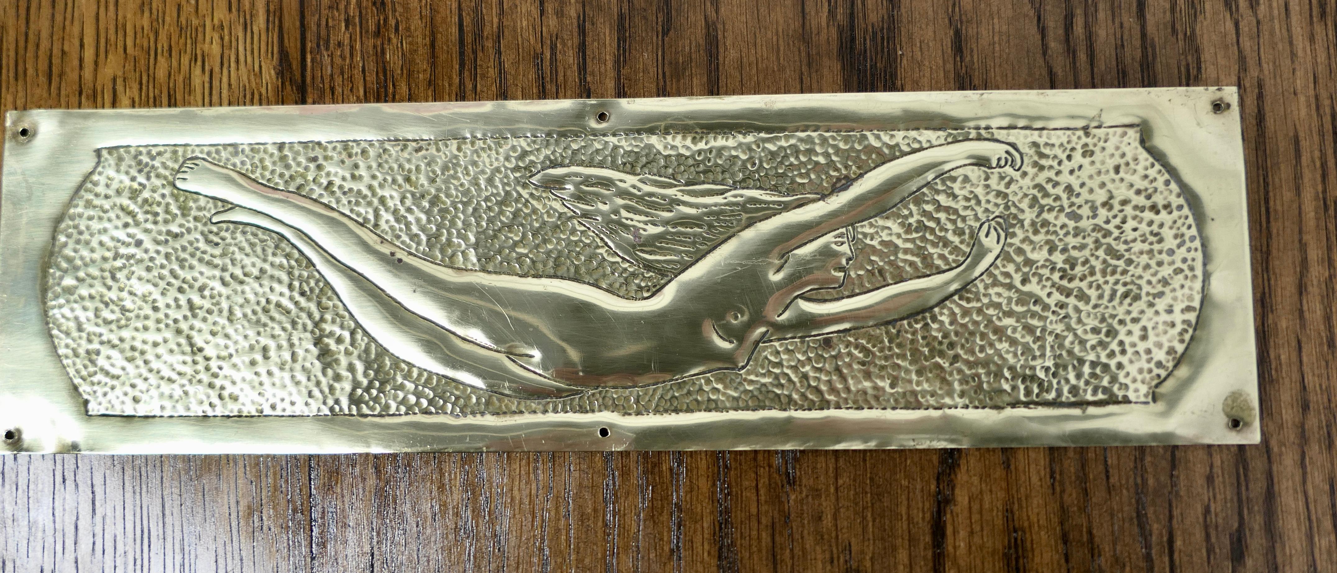 Art Deco brass door finger plate, door-furniture 

The finger plate is hand made in brass and has charming delightful nude, a classic from the era
 
The plate is in good used condition and with small screw fixing holes, it is 10” long and 3”