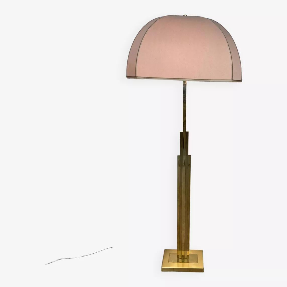 Brass art deco floor lamp produced in the 70s. Original lampshade (very slight deformation on one of the sides of the lampshade). Double lighting system.