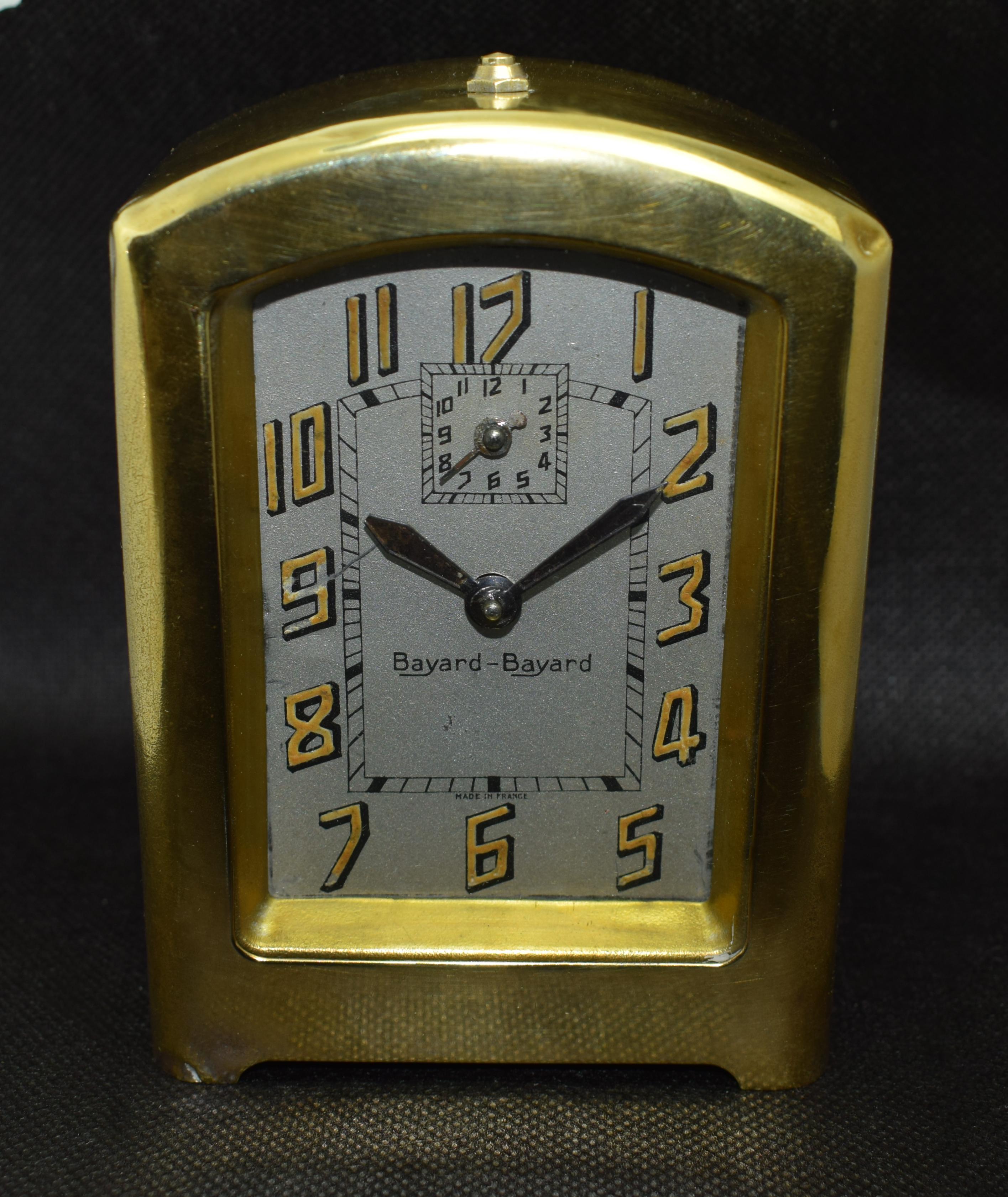 This clock is pure joy to look at if you admire the aesthetics of Art Deco. The highly styled numerals which are filled in mustard yellow paint compliment the brass casing and would of originally illuminated in the dark ( they no longer do this).
