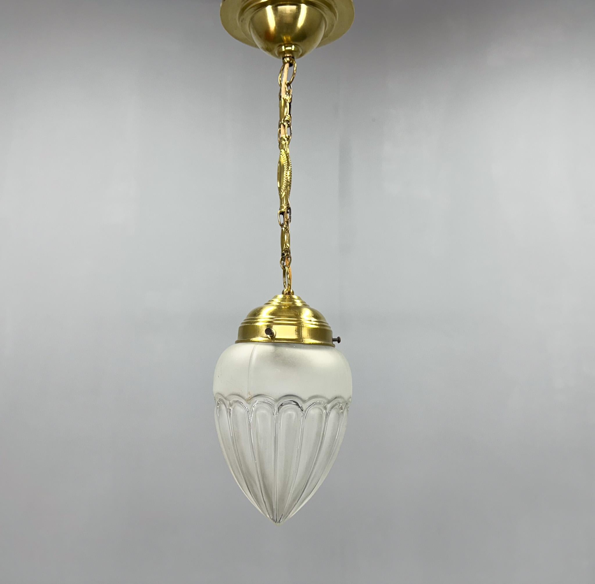 Art deco pendant light made of brass and sandblasted glass made in Germany in the 1930's. New wiring, restored. Bulb: 1 x E26 (E27). US wiring compatible.