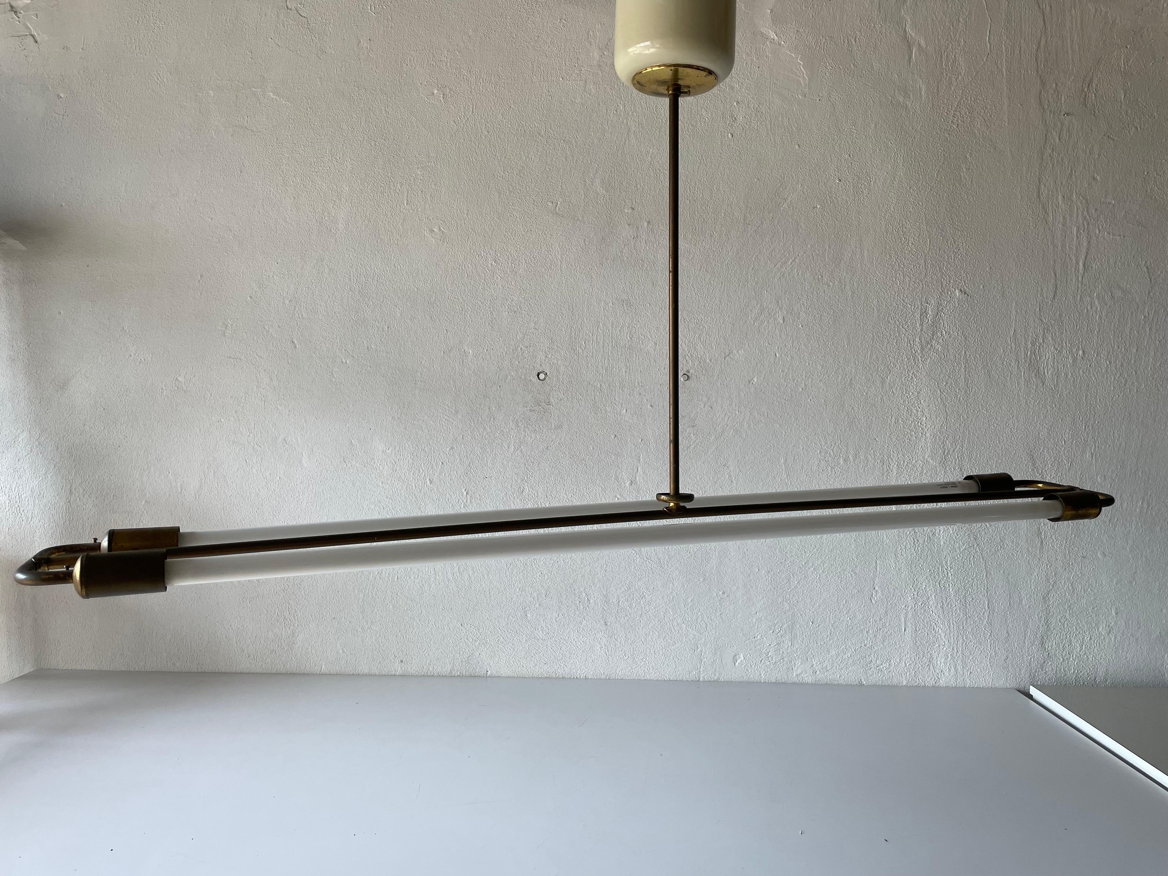 Brass Art Deco Bauhaus chandelier by Kaiser & Co., 1930s, Germany

Industrial ceiling lamp with two fluorescent Tubes

Lampshade is in very good vintage condition.
Original canopy.

This lamp works with 2 fluorescent Tubes.
Wired and