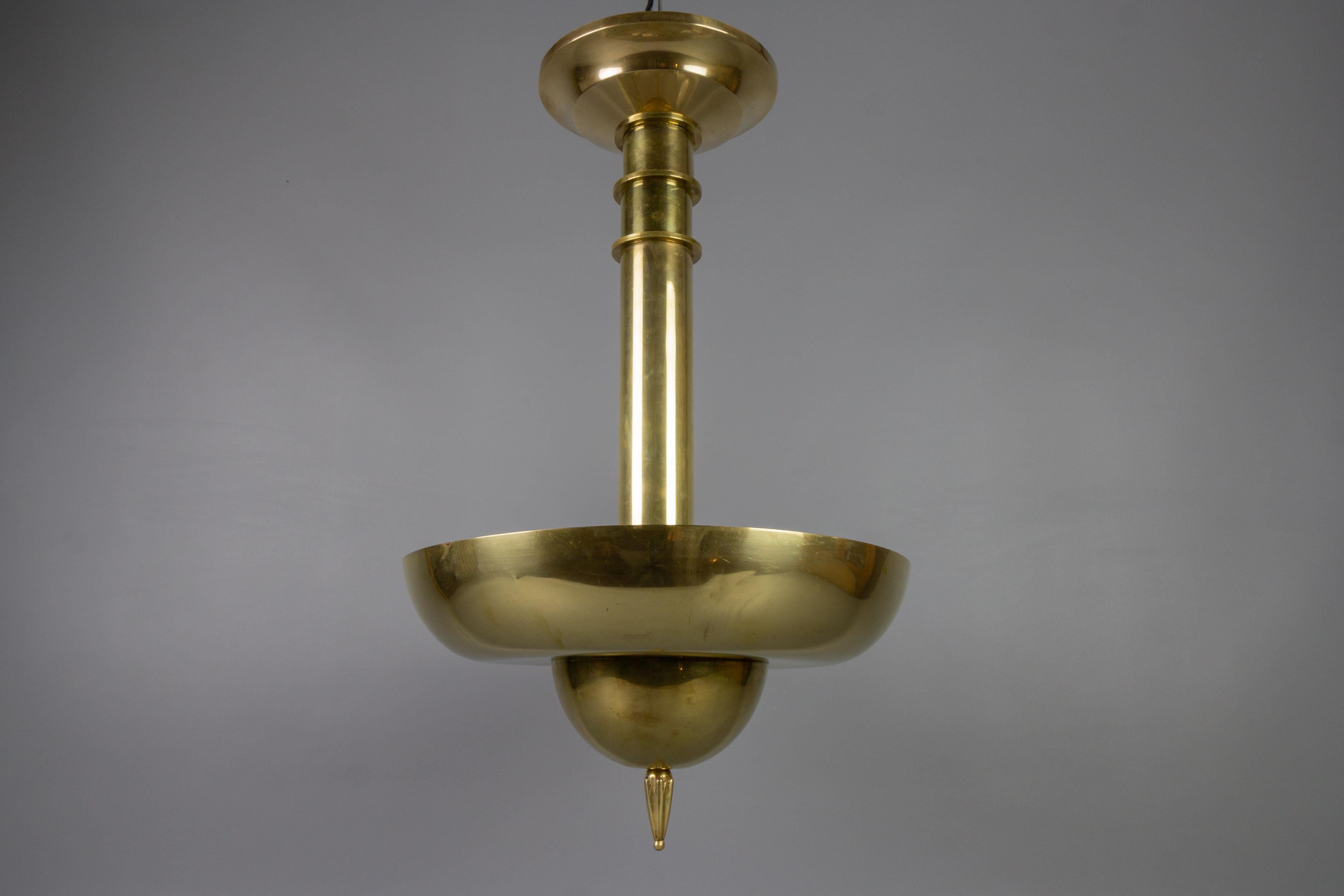 Art Deco brass inverted dome six-light pendant lamp, Germany, ca. 1930.
Impressive and very unusual inverted dome brass pendant chandelier with six interior lights - six sockets for E14 size light bulbs.
Dimensions: height: circa 60 cm / 23.62 in;