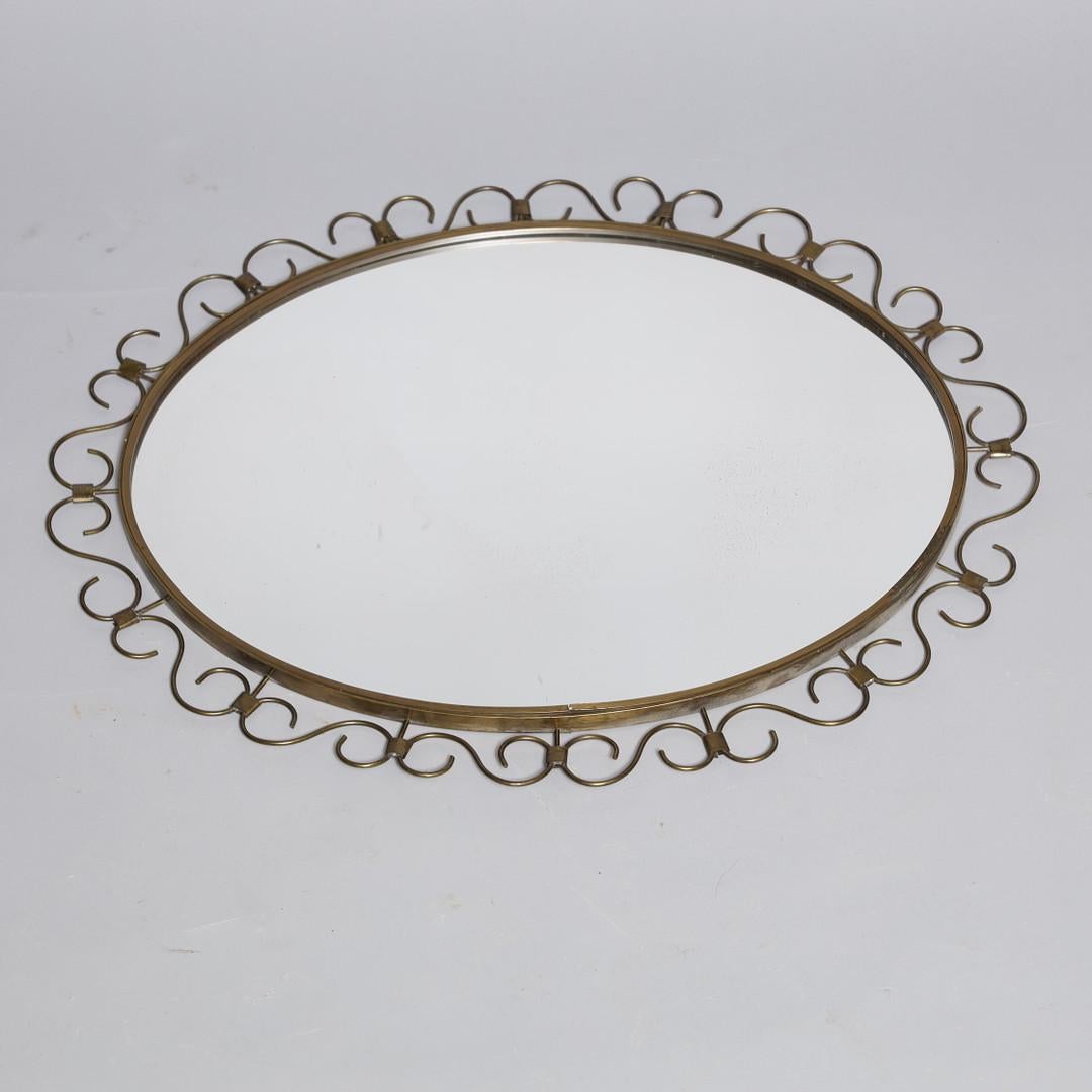 Specchio in ottone Art Deco. Circa anni '50.
