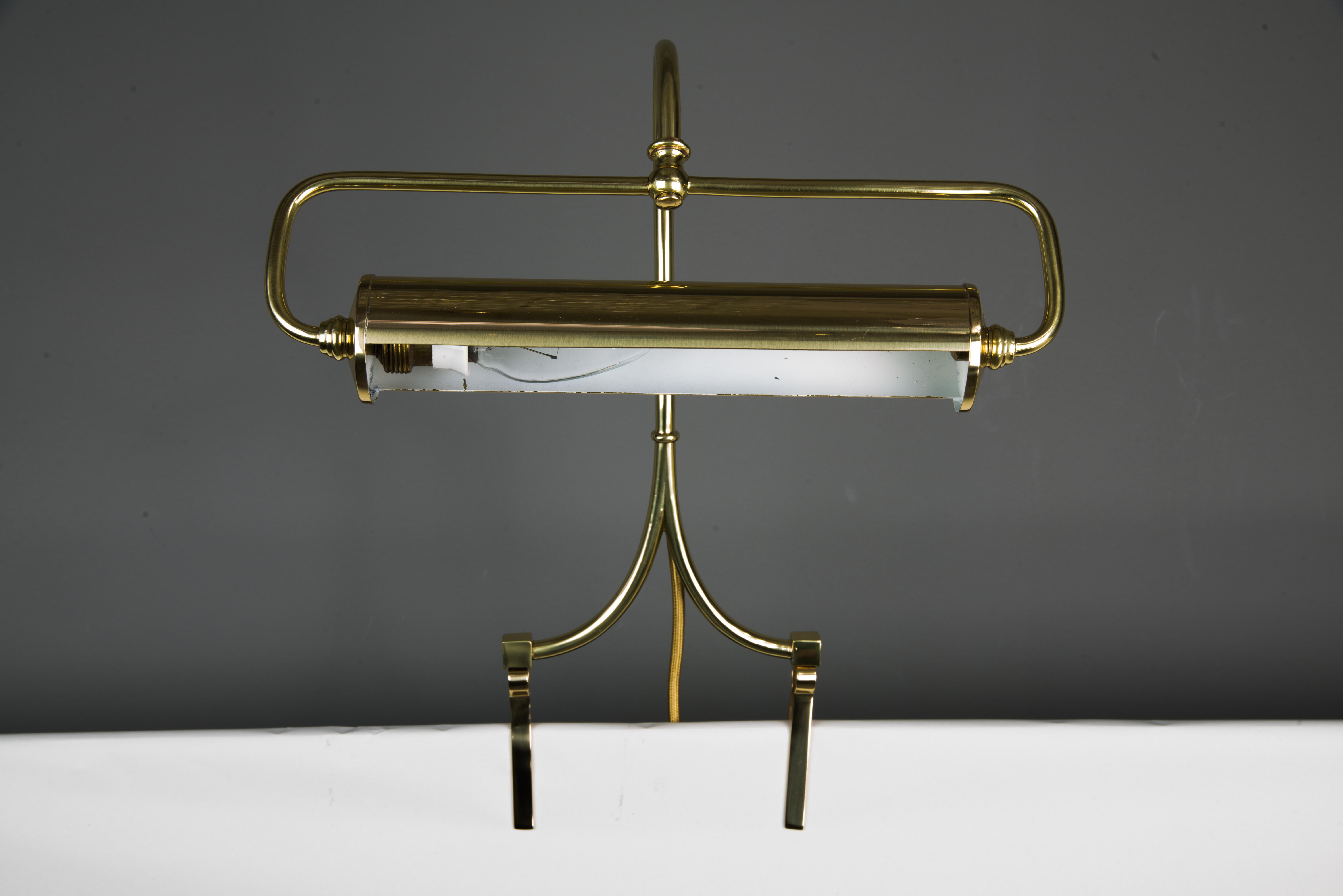 Art Deco brass piano note stand lamp, circa 1920s
Polished and stove enameled.