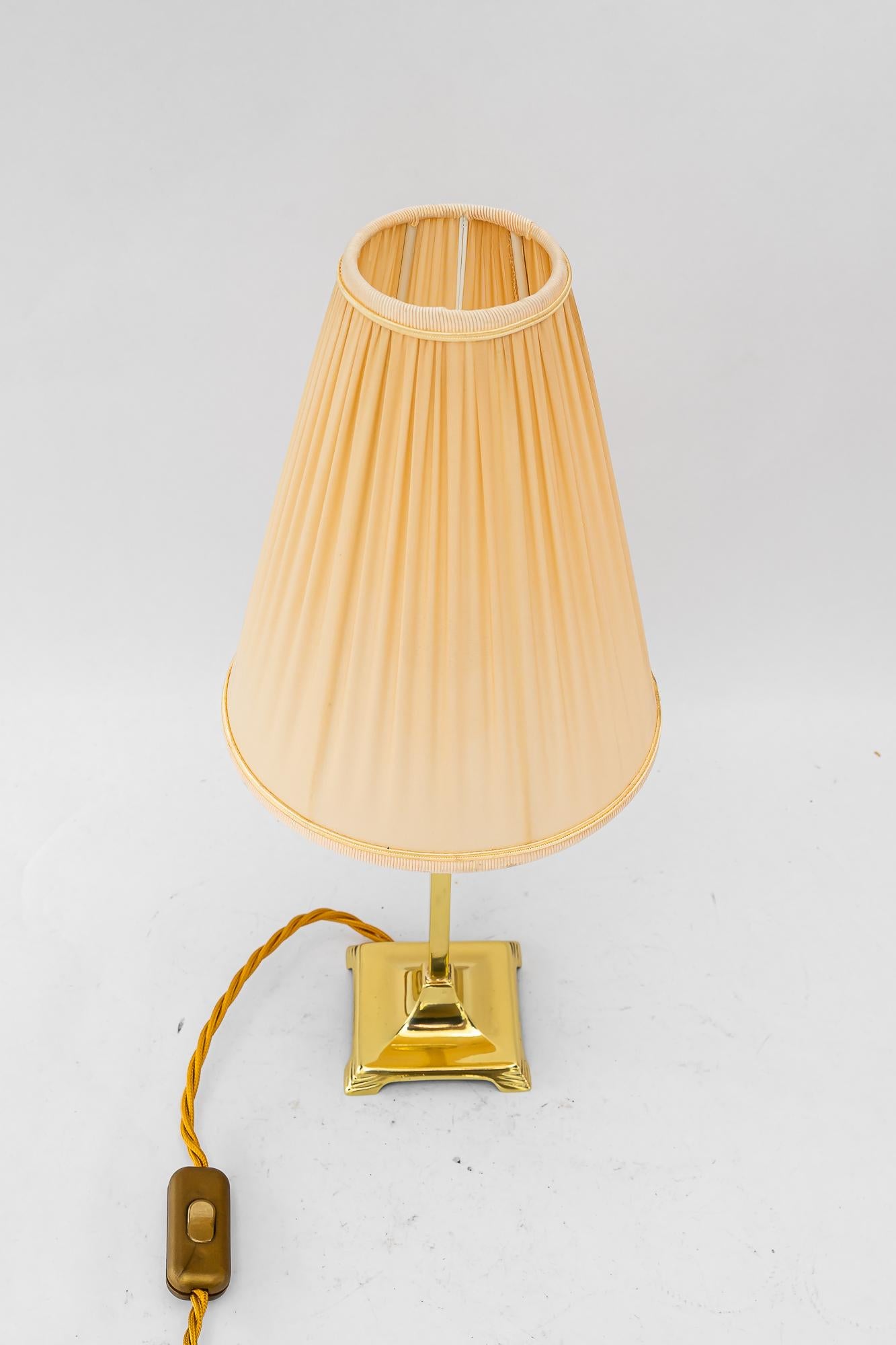 Art Deco brass Table lamp with fabric shade vienna around 1920s
Brass polished and stove enameled
The fabric shade is replaced ( new )