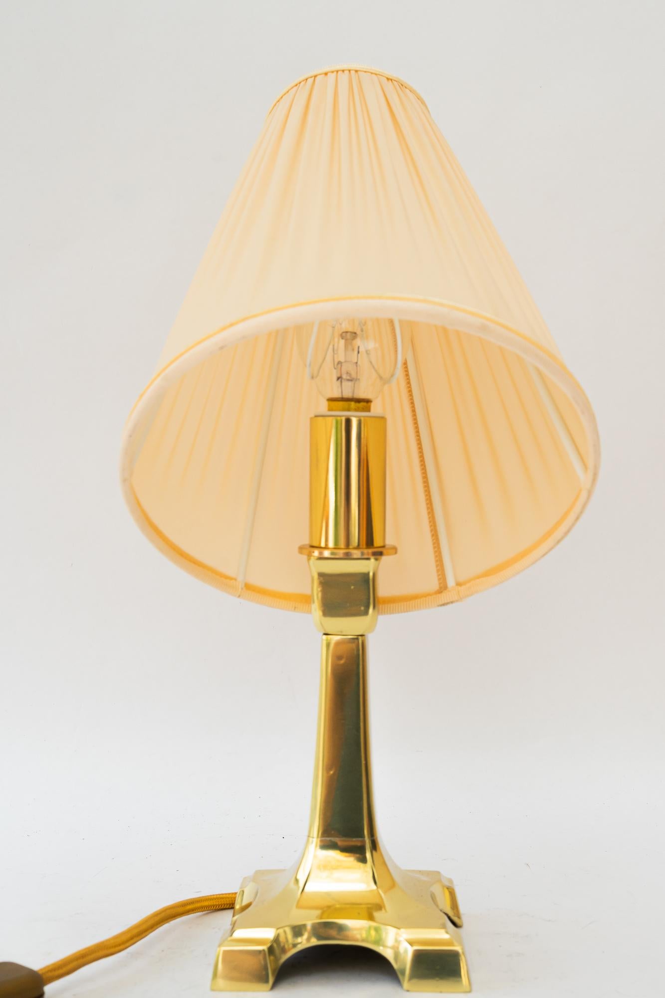 Lacquered Art Deco brass table lamp with fabric shade vienna around 1920s For Sale