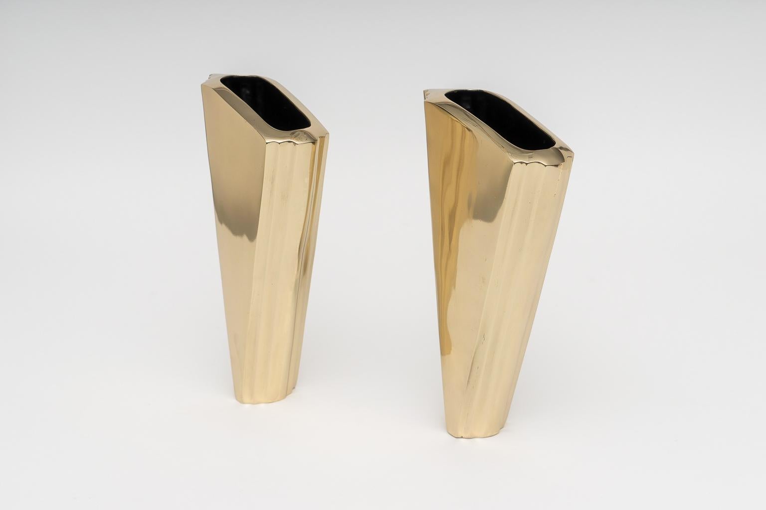 This stylish set of Art Deco style brass vases date to the 1980s and were designd by Larry Laslo. 

Note: The pieces have been professionally polished.