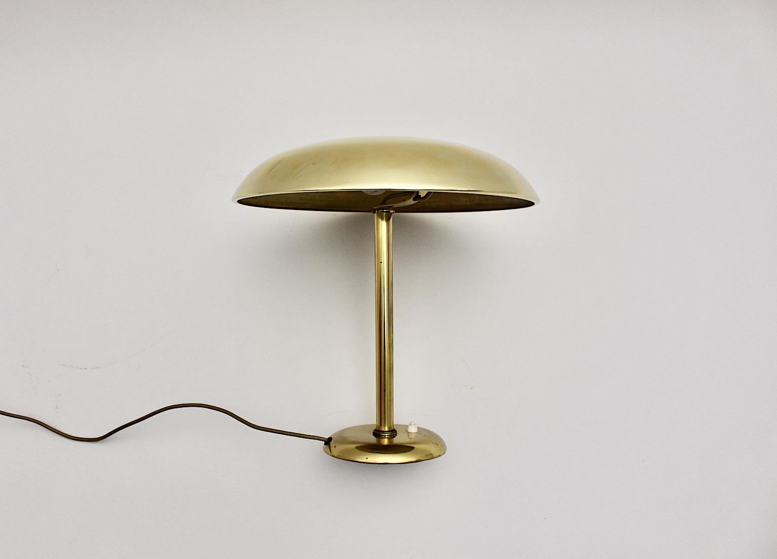 Art Deco vintage mushroom table lamp or desk lamp from brass 1930s Vienna.
While the lamp shade shows beautiful mushroom like shape the cast iron base provides a safe and secure standing. On/off switch at the base
Could work very well as desk lamp