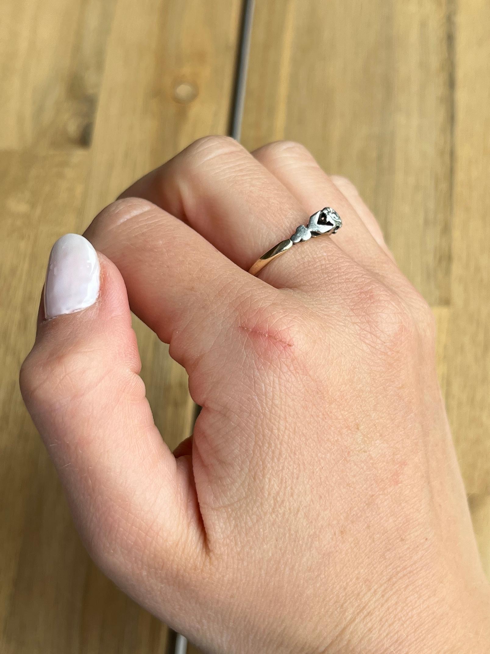 This beautiful solitaire ring is modelled in 9 carat gold and the stone set in platinum. The diamond measures 8pts and is set in an illusion platinum setting. Made by Bravingtons. 

Ring Size: M 1/2 or 6 1/2 
Height Off Finger: 5mm

Weight: 2.2g