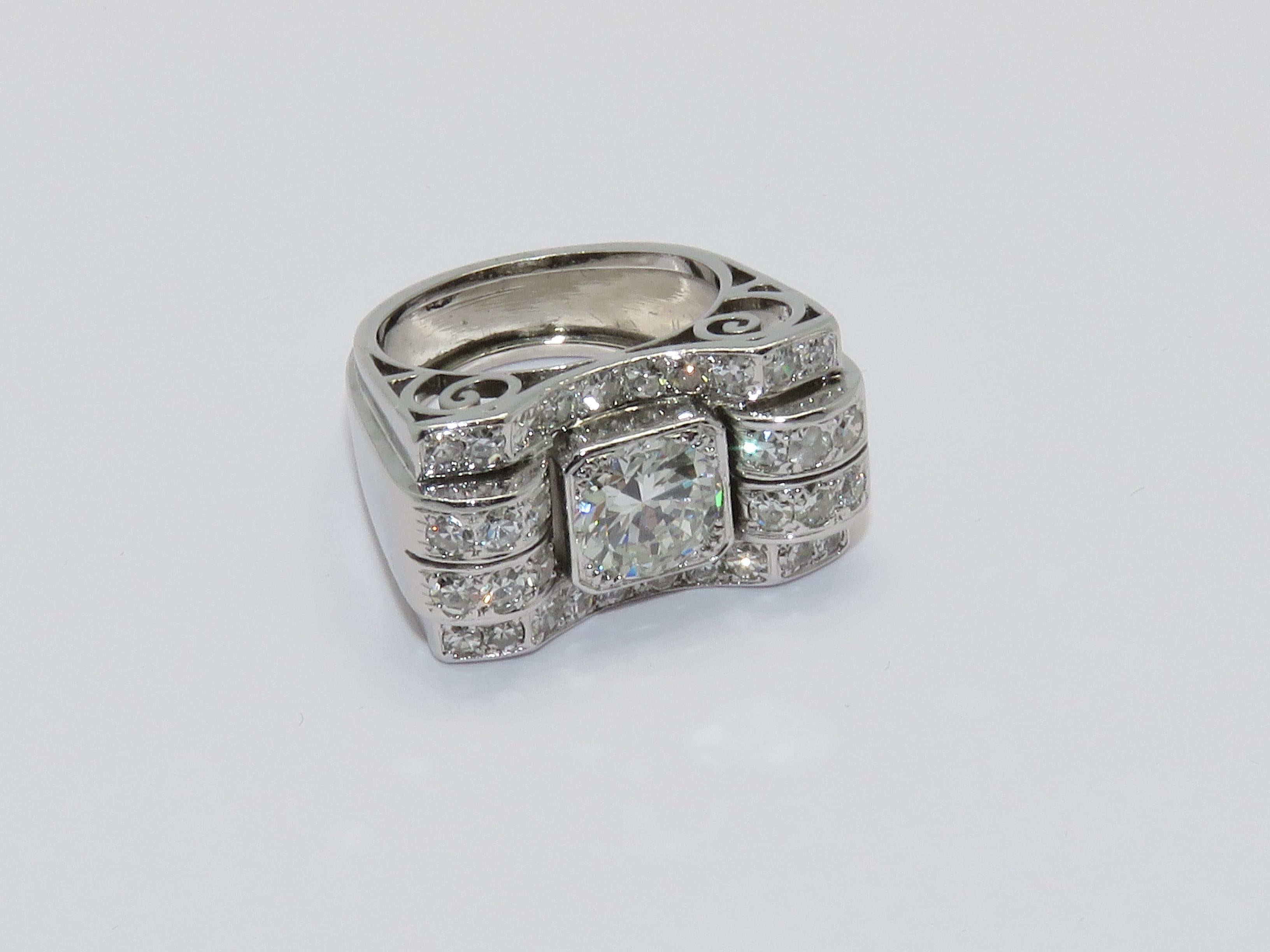 The Central Diamond weights 1.60 carat approximately and the total weight of the diamonds is 2 Ct.

Ring Size: 6
Measurements:
Height: 0.91 in      Width: 0.55 in      Length: 0.91 in      Weight: 17.20 grams