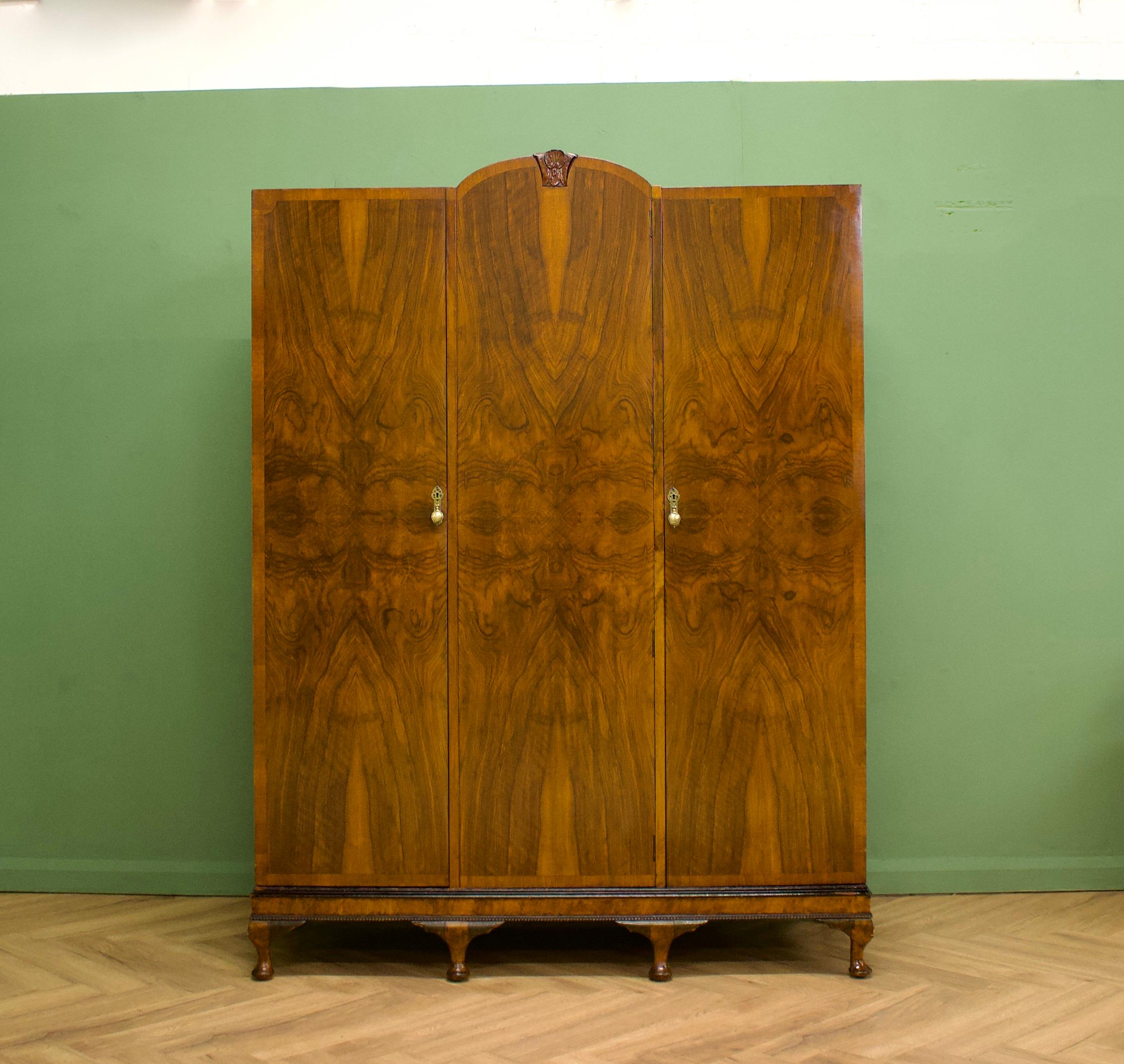 An impressive quality, 1930's burr walnut triple door wardrobe - perfect for a maximalist interior
The intense walnut veneers have been beautifully quarter matched on the doors 
This piece is Art Deco in style, with influences of Art Nouveau -