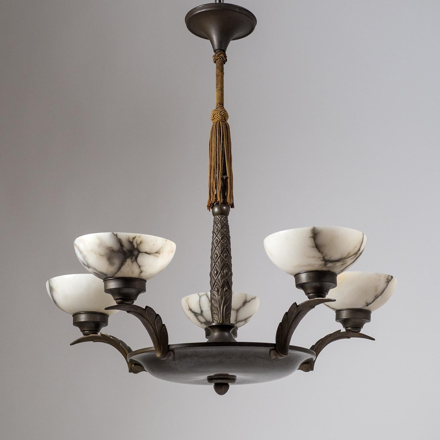 Superb five-arm Art Deco chandelier from the early 20th century. Dark patinated bronze hardware with abstracted palm tree ornaments - the central stem has the shape of a palm tree trunk while the arms are worked as stylized palm leaves. Each arm has