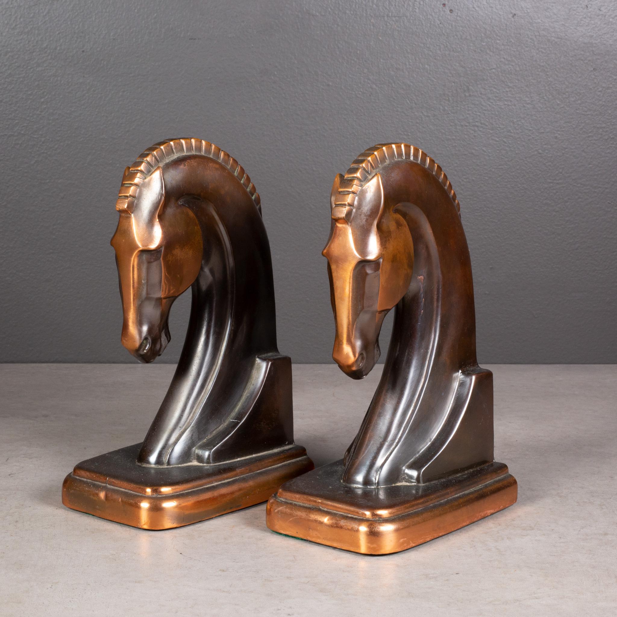 ABOUT

A pair of Art Deco metal Trojan horse bookends manufactured by Dodge Trophy Inc. Both pieces have retained their original bronze and copper finish and are in good condition with appropriate patina for their age. Substantial in weight.

   