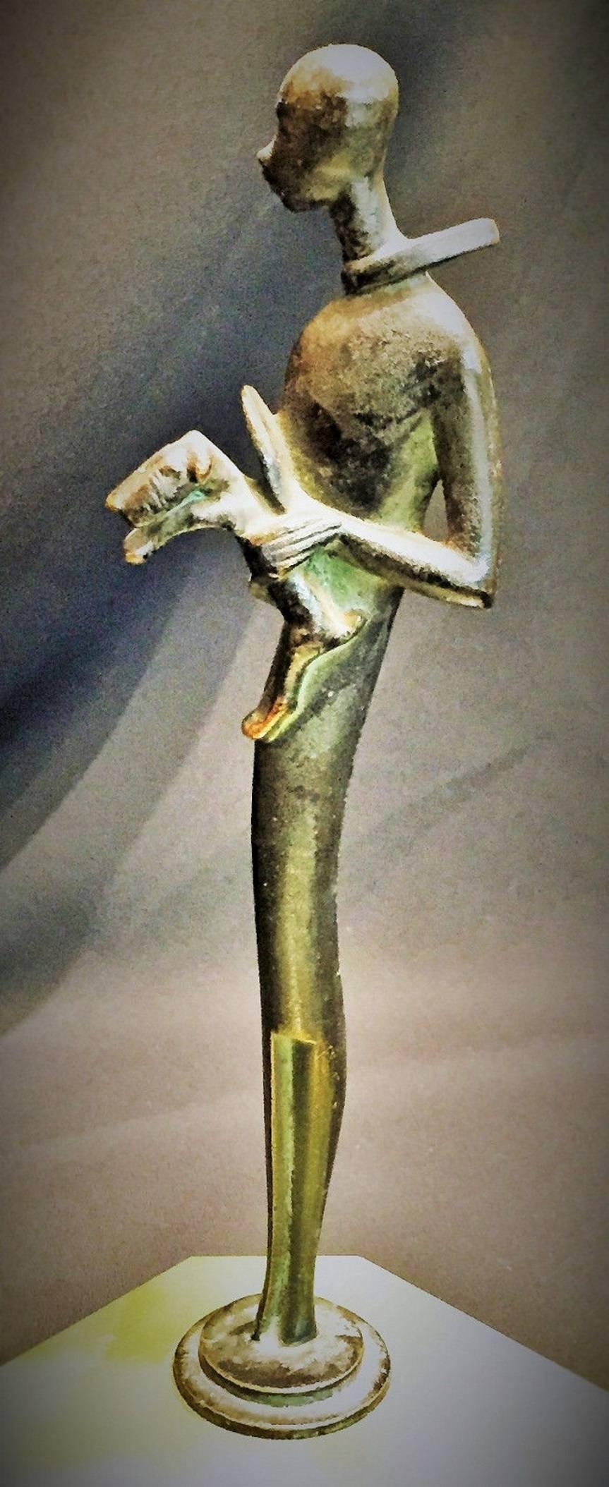 Unmarked, probably Austrian, this charming carved green agate octagonal vide poche with green/black patinated bronze handle is done in the manner of Hagenauer - a superbly detailed and stylized slender tall man, wearing a scarf waving in the wind,