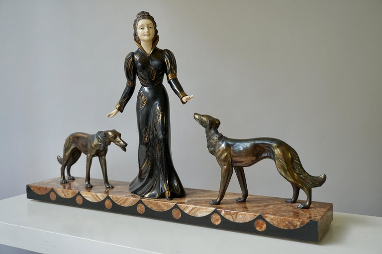 Bronze Art Deco sculpture of a woman with greyhounds on marble base. Signed Salvatore Melani (Italian, 1902-1934)
Salvatore Melani was an Italian sculptor active in the first part of 20th century. It is in very good condition with only very minor