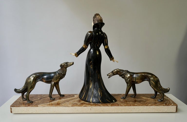Early 20th Century Art Deco Bronze and Marble Sculpture of a Woman with Greyhounds Signed S Melani